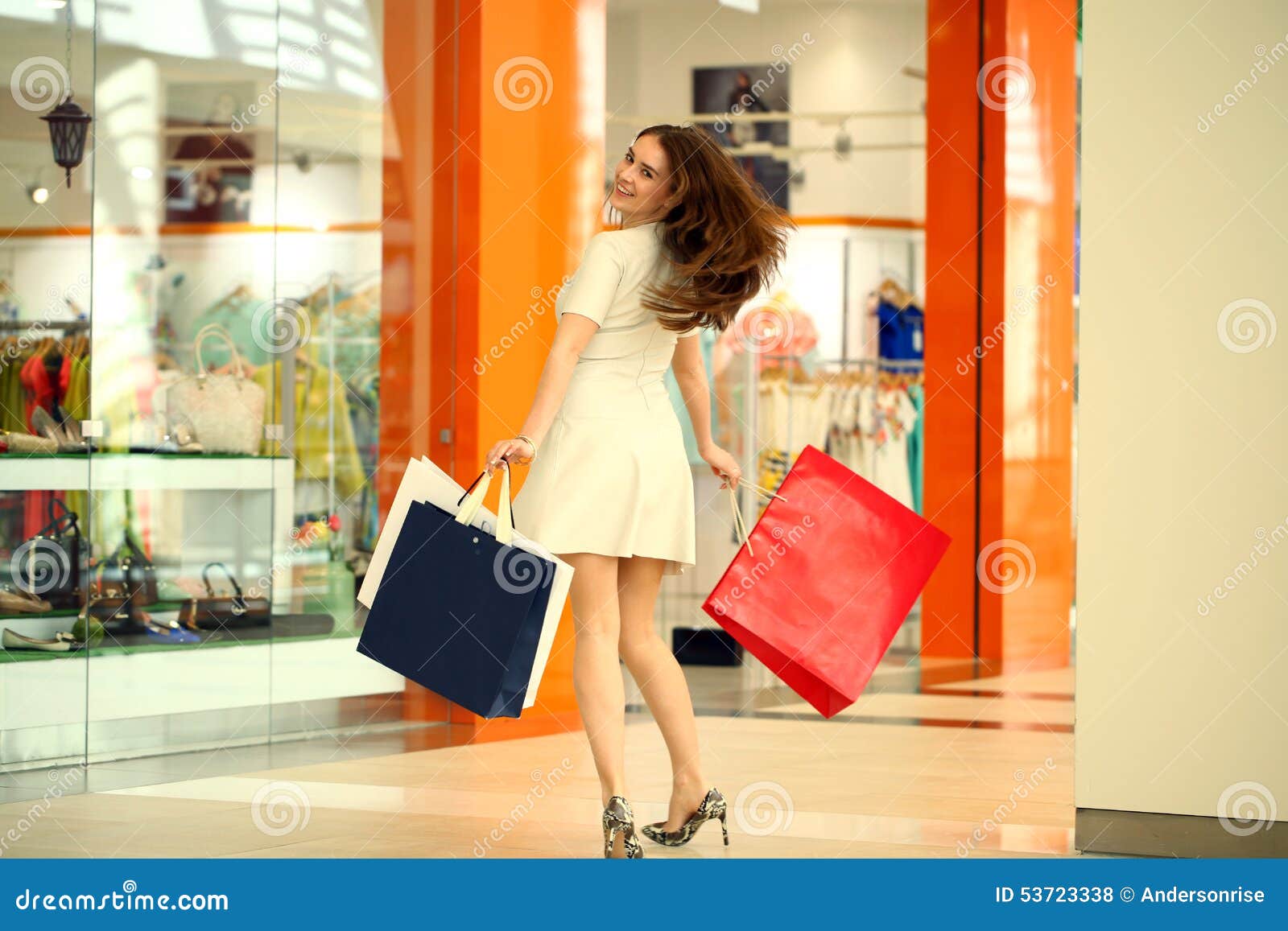 Beautiful Young Woman Holding Shopping Bags Walking in the Shop Stock ...