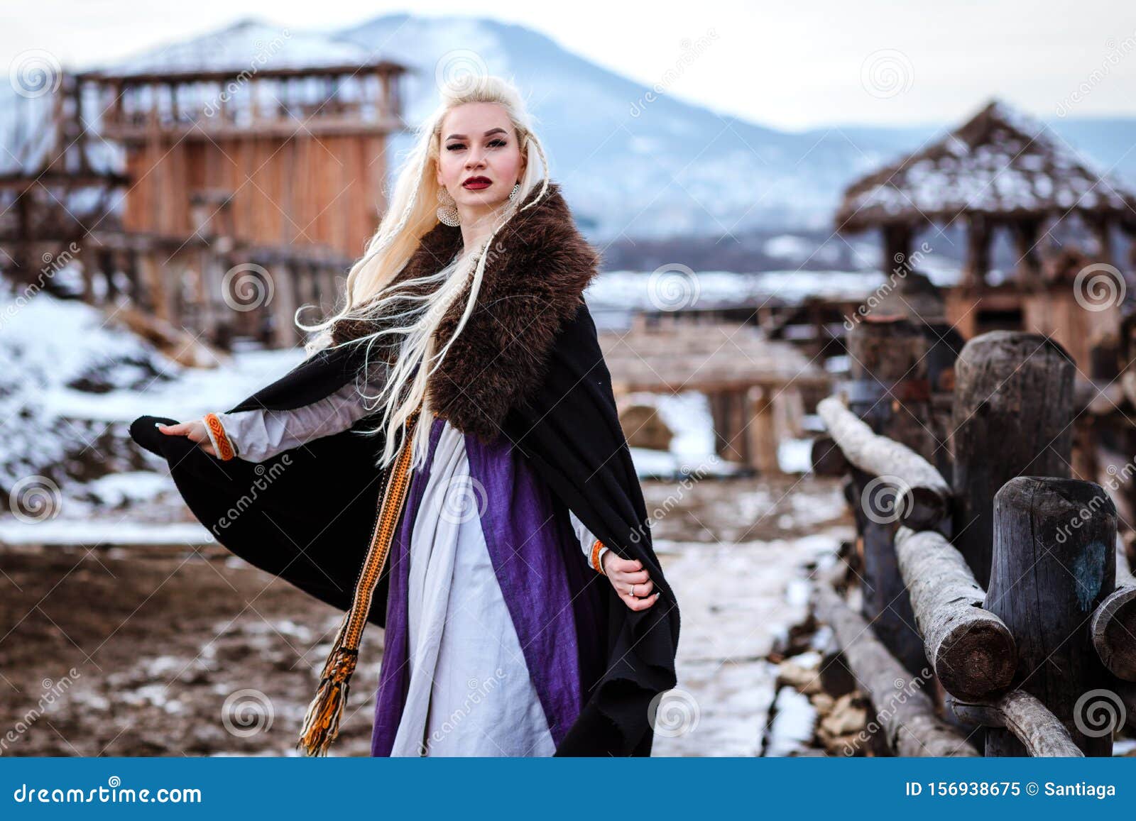 Beautiful Young Woman Holding a Viking with Blond Hair. Image of ...