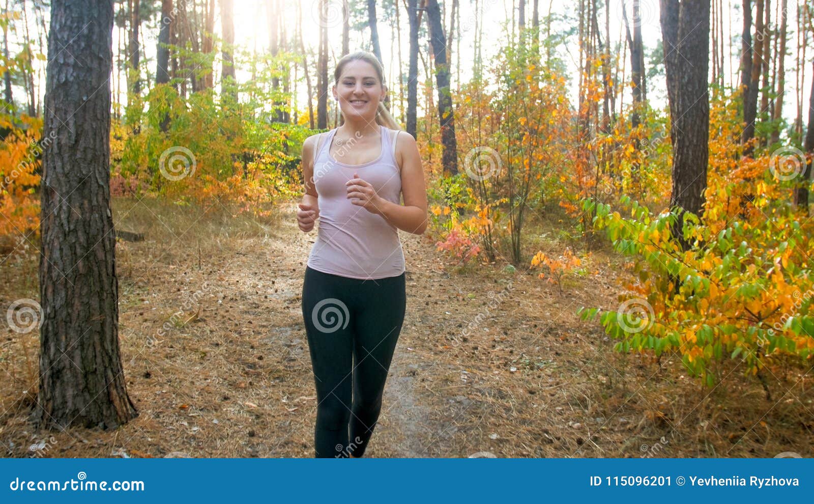 Beautiful Young Woman In Black Leggings Jogging In