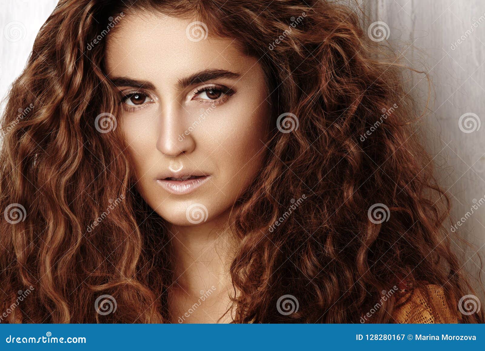 beautiful young woman with long curly hairstyle, fashion