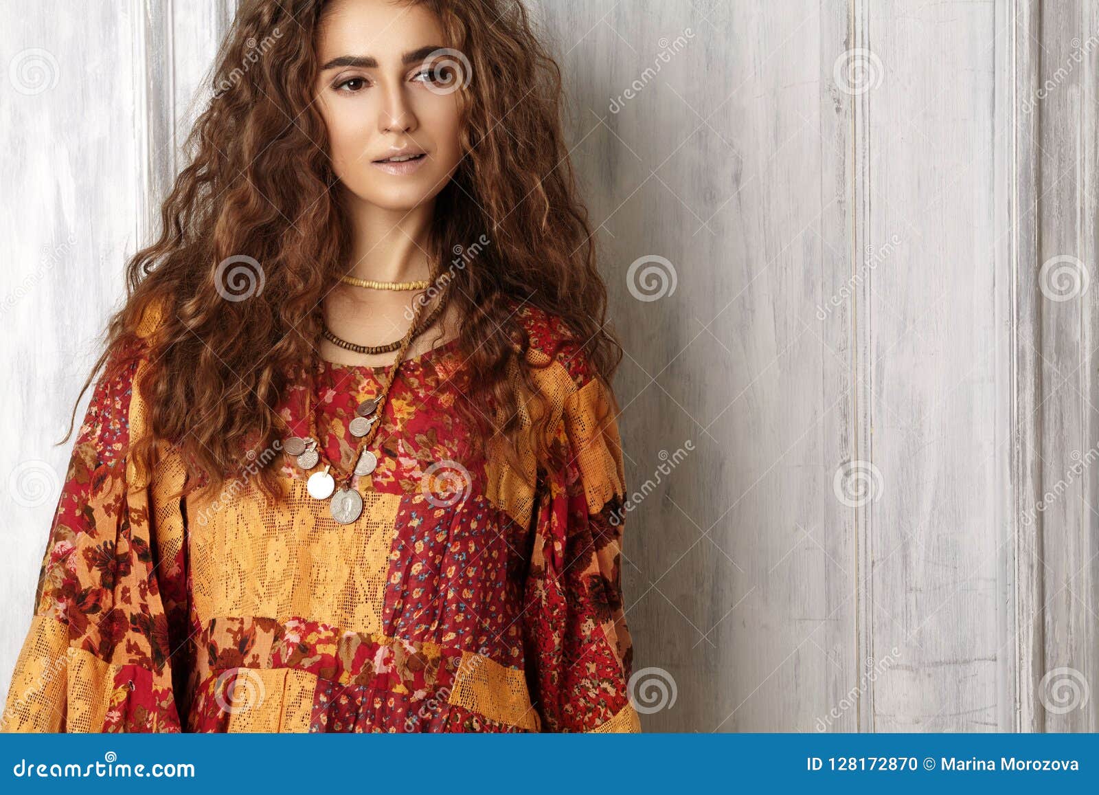 beautiful young woman with long curly hairstyle, fashion
