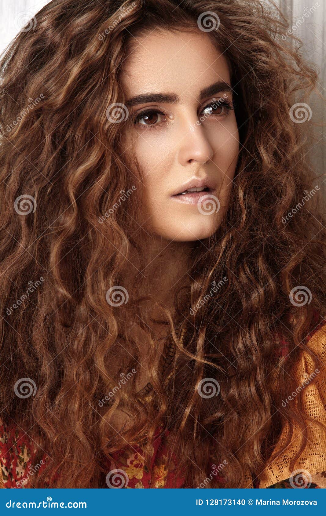 beautiful young woman with long curly hairstyle, fashion