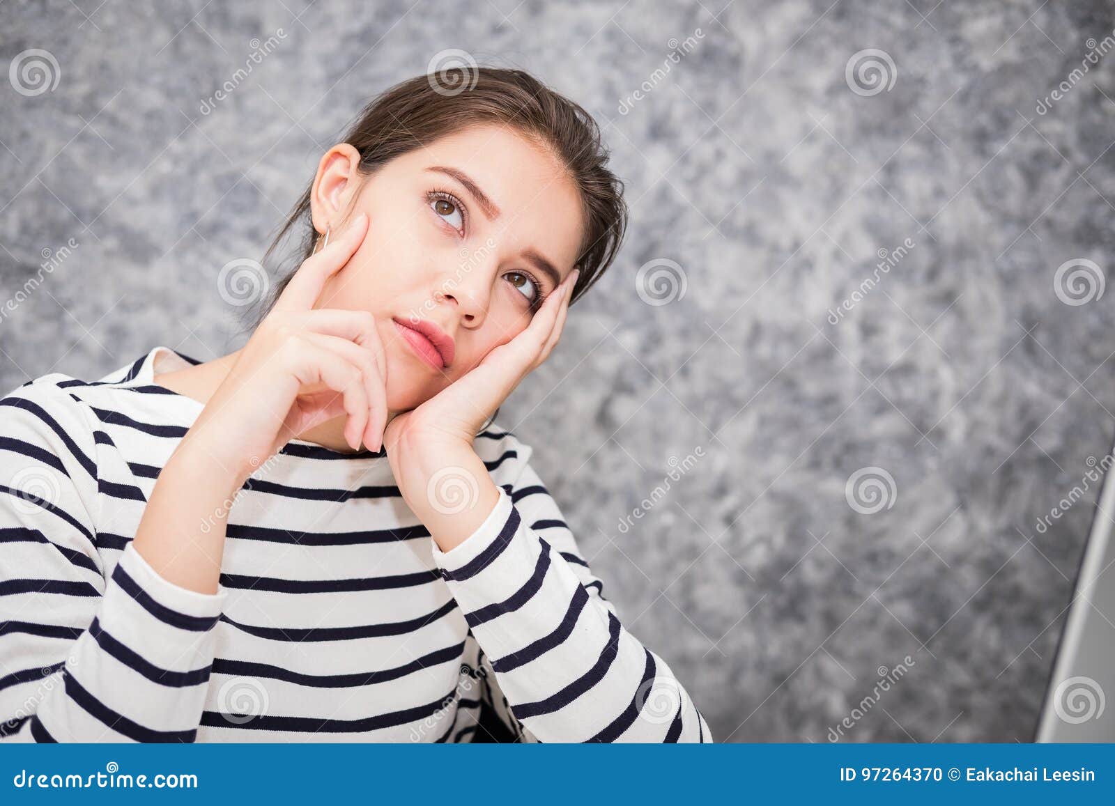 Beautiful Young Woman Looking at a Computer Screen and Thinking at the ...