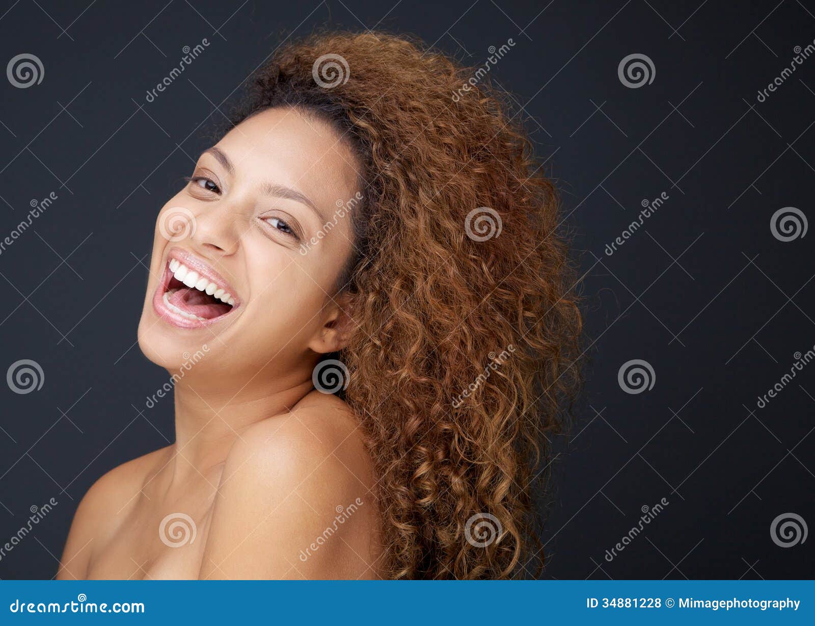 beautiful young woman with naked shoulders laughing