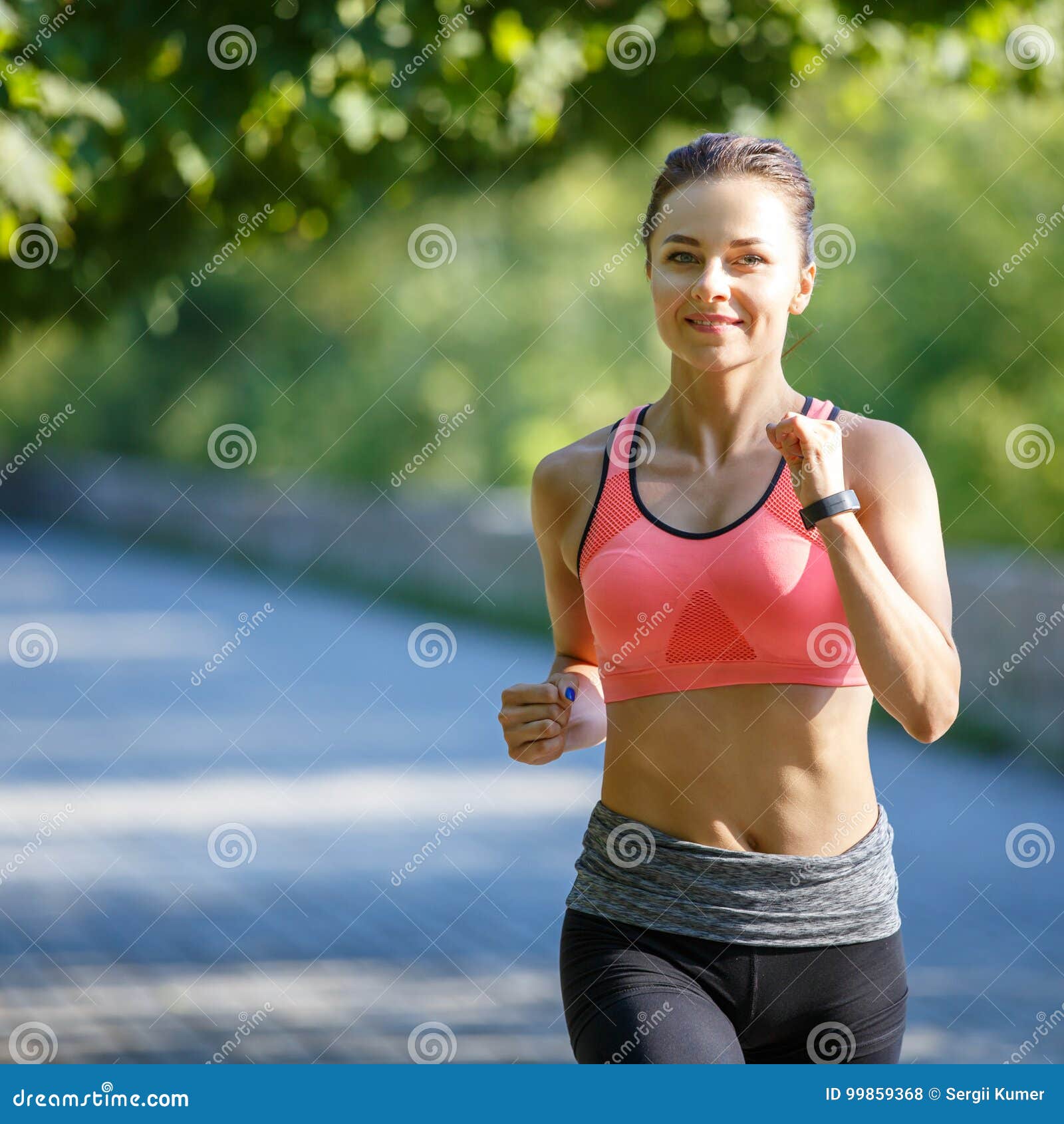 Beautiful Young Woman In Pink Top Jogging In Park Stock Photo - Image ...