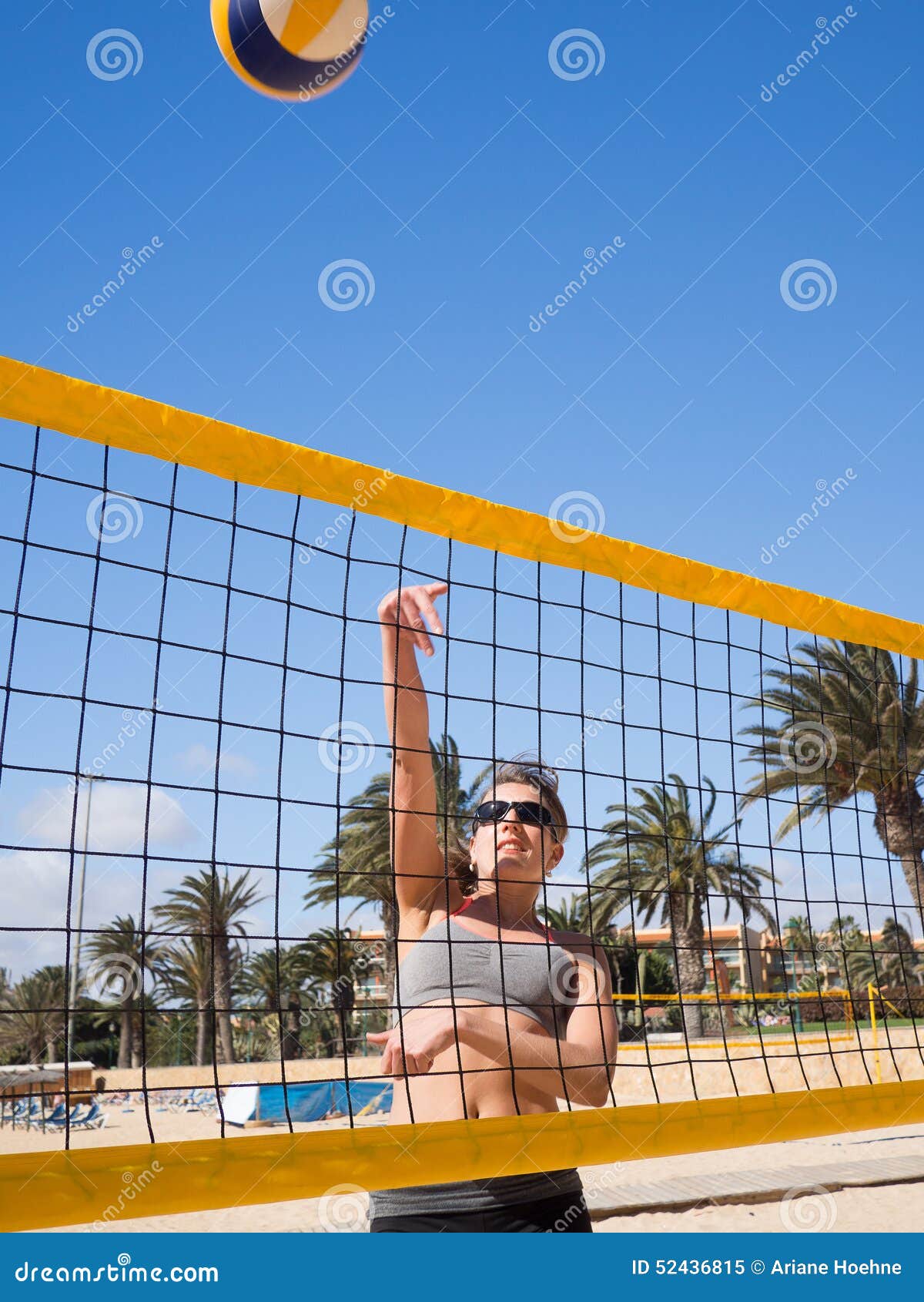 beautiful young woman playing beachvolleyball