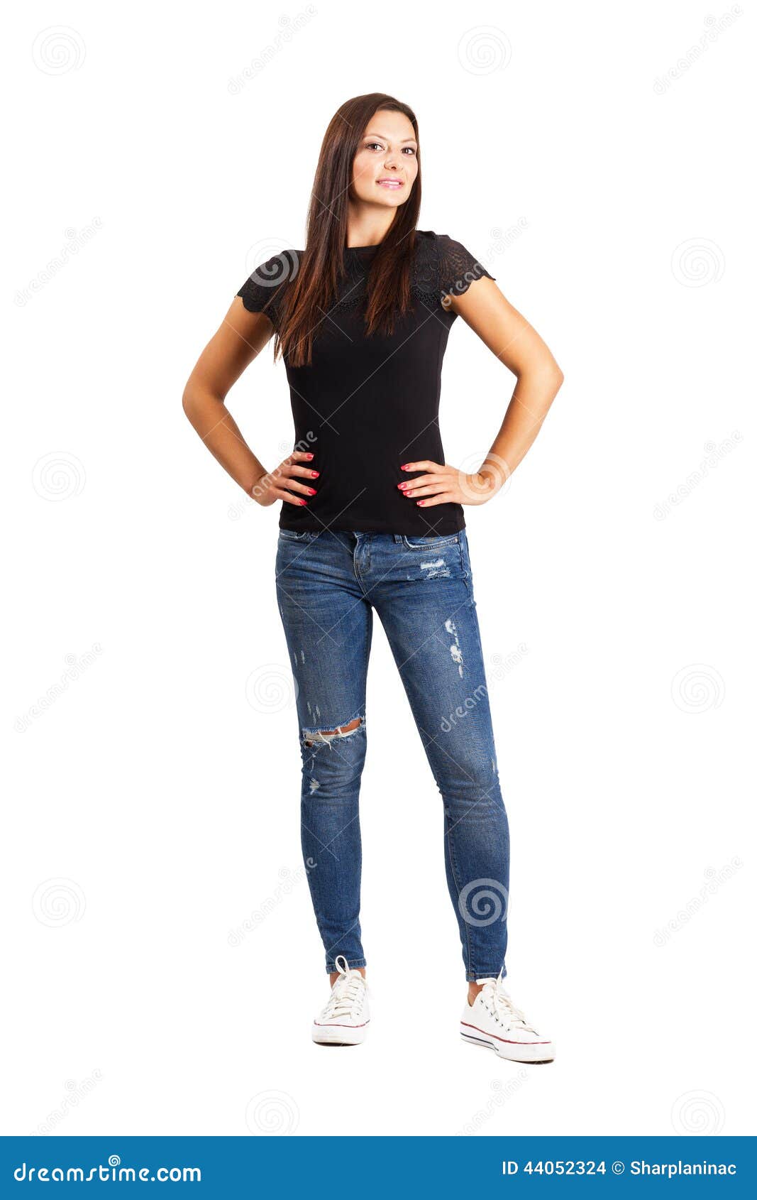 Beautiful Young Woman Posing with Arms on Her Hips Stock Photo - Image ...