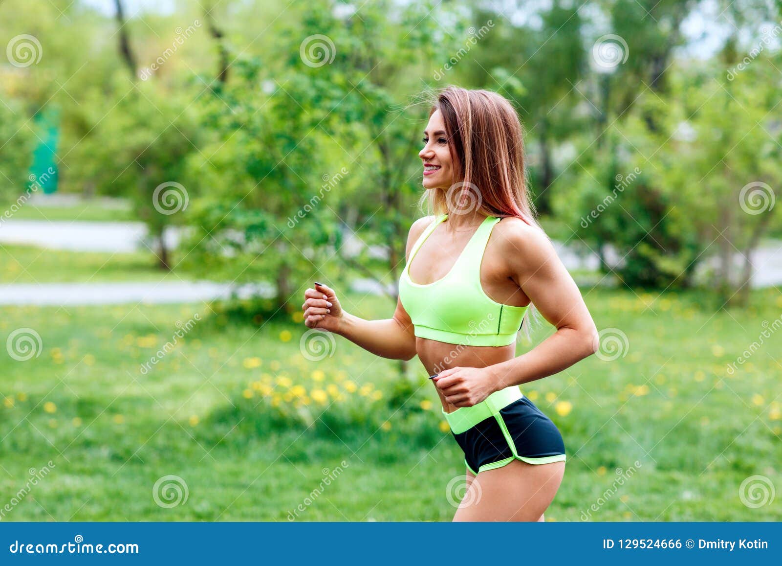 Beautiful Young Woman Running in the Green Summer Park. Stock Photo ...