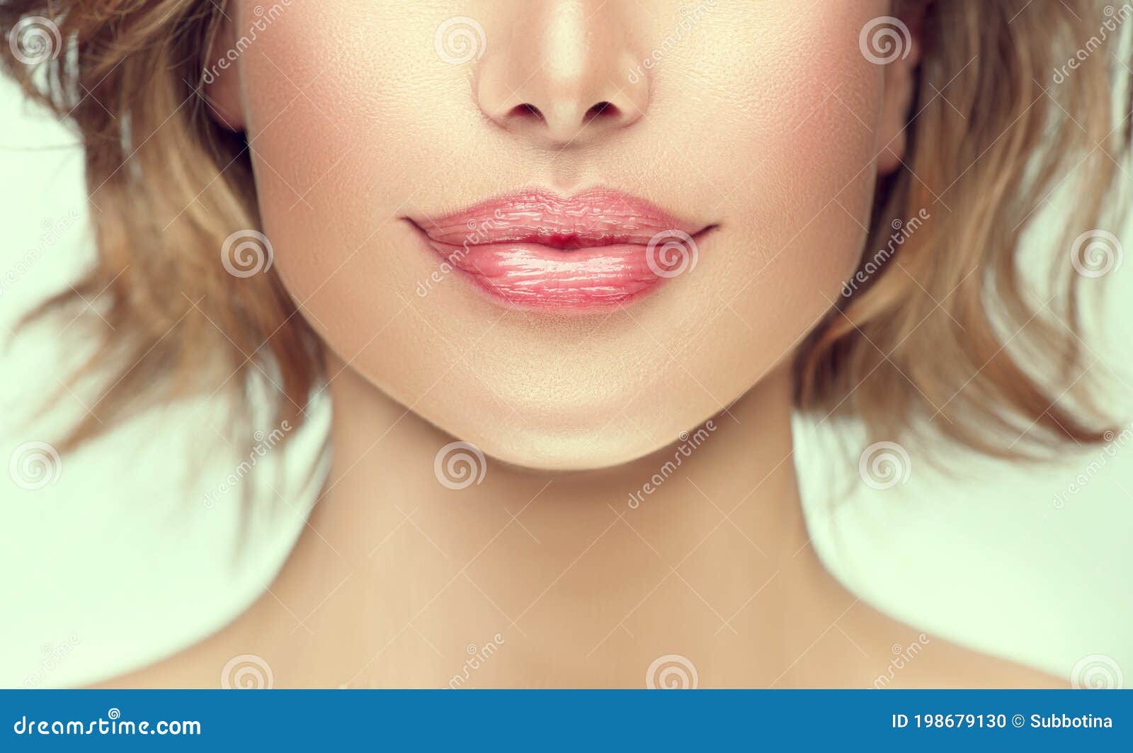 beautiful young woman`s lips closeup. plastic surgery, fillers, injection. part of the model girl face, youth concept