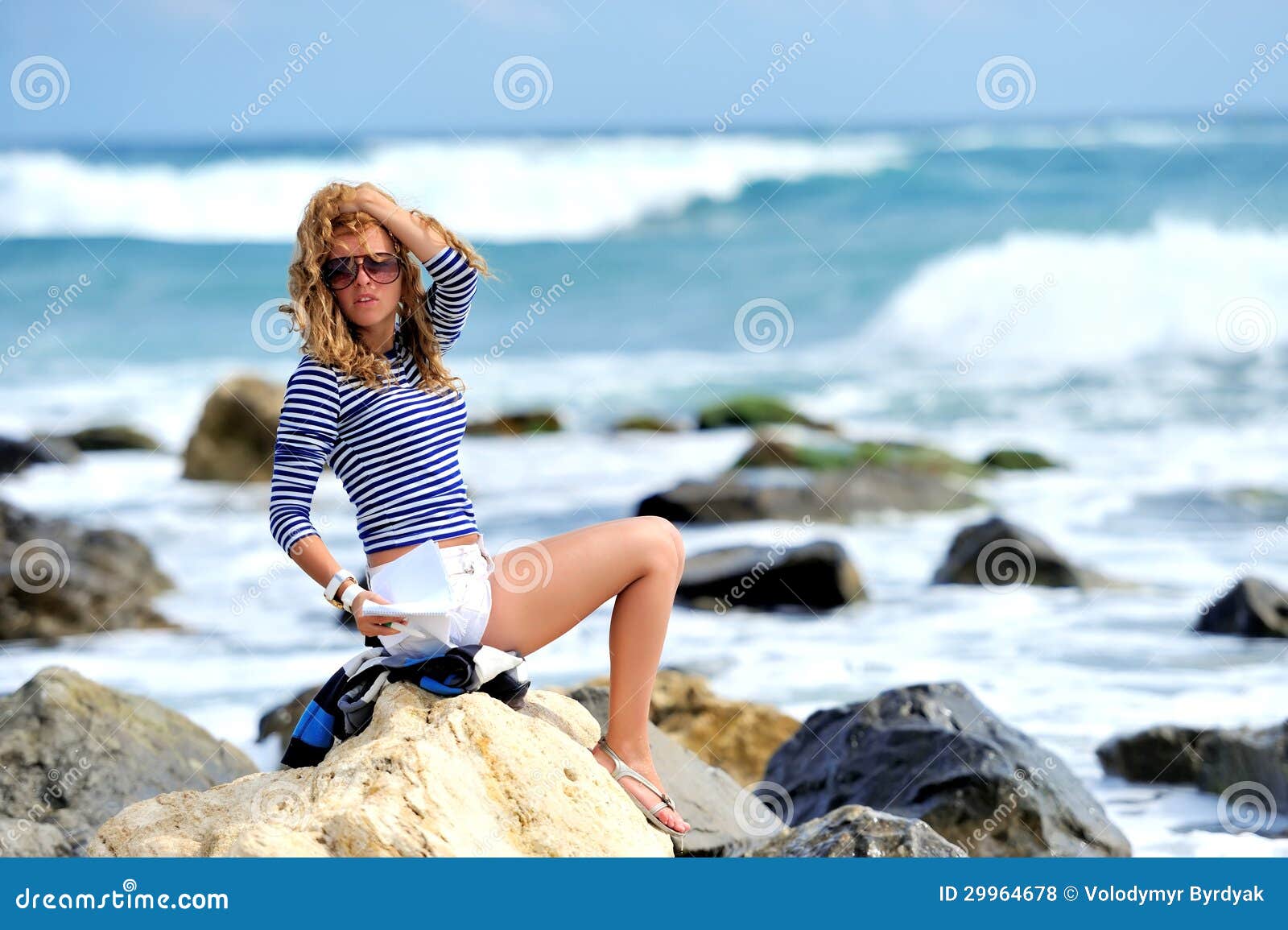 Beautiful Young Woman Sitting on the Stone Stock Photo - Image of ...