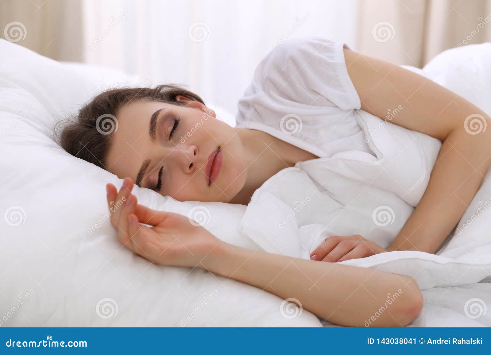 Young Beautiful Woman Sleeping In Her Bed And Relaxing In 