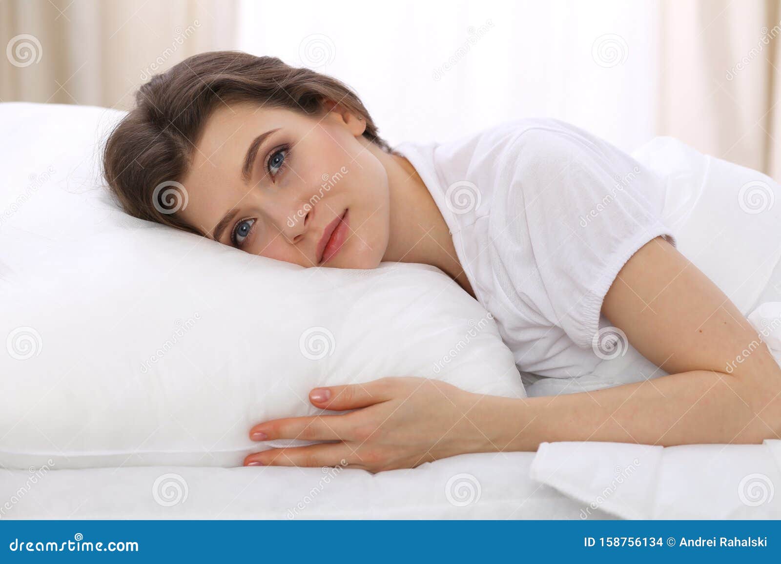 Beautiful Young Woman Sleeping While Lying In Her Bed 