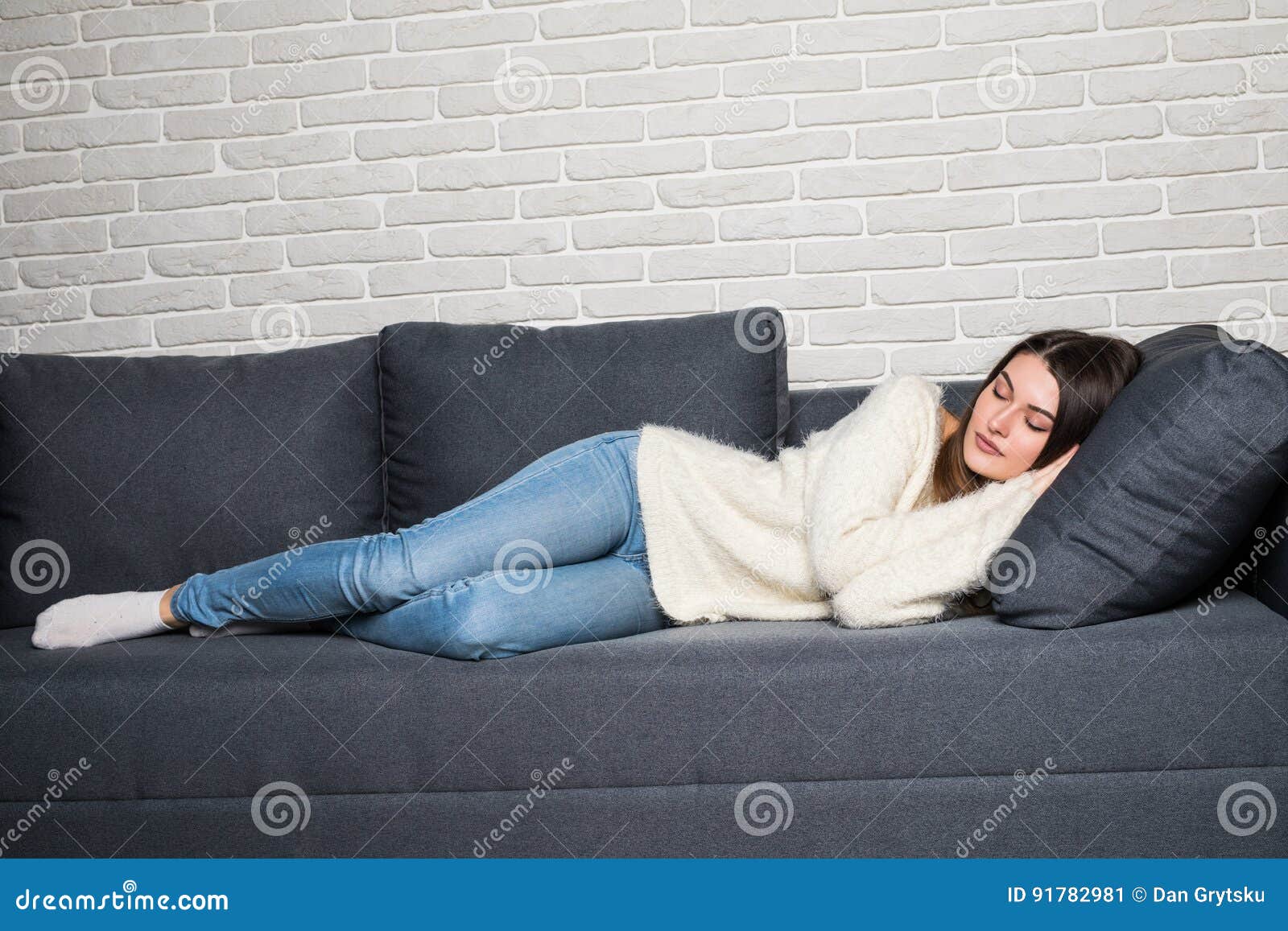 Beautiful Young Woman Sleeping On Sofa Indoors At Home Stock Image