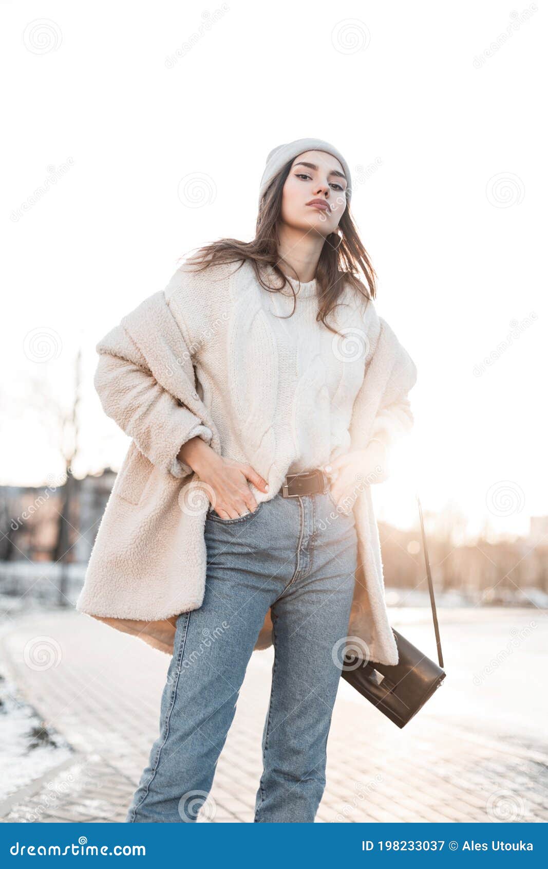 Beautiful Young Woman in Trendy Warm Winter Clothes is Enjoys the Bright  Sunset on a Street in the City. Cute Girl Fashion Model Stock Image - Image  of bright, outdoors: 198233037