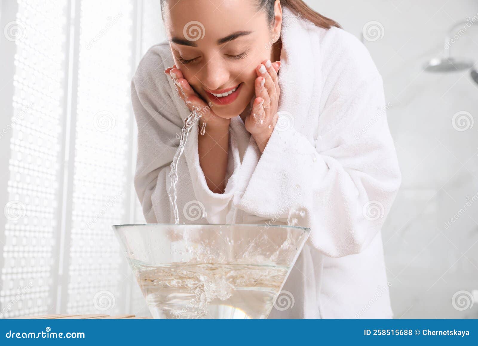 Beautiful Young Woman Washing Her Face With Water In Bathroom Stock