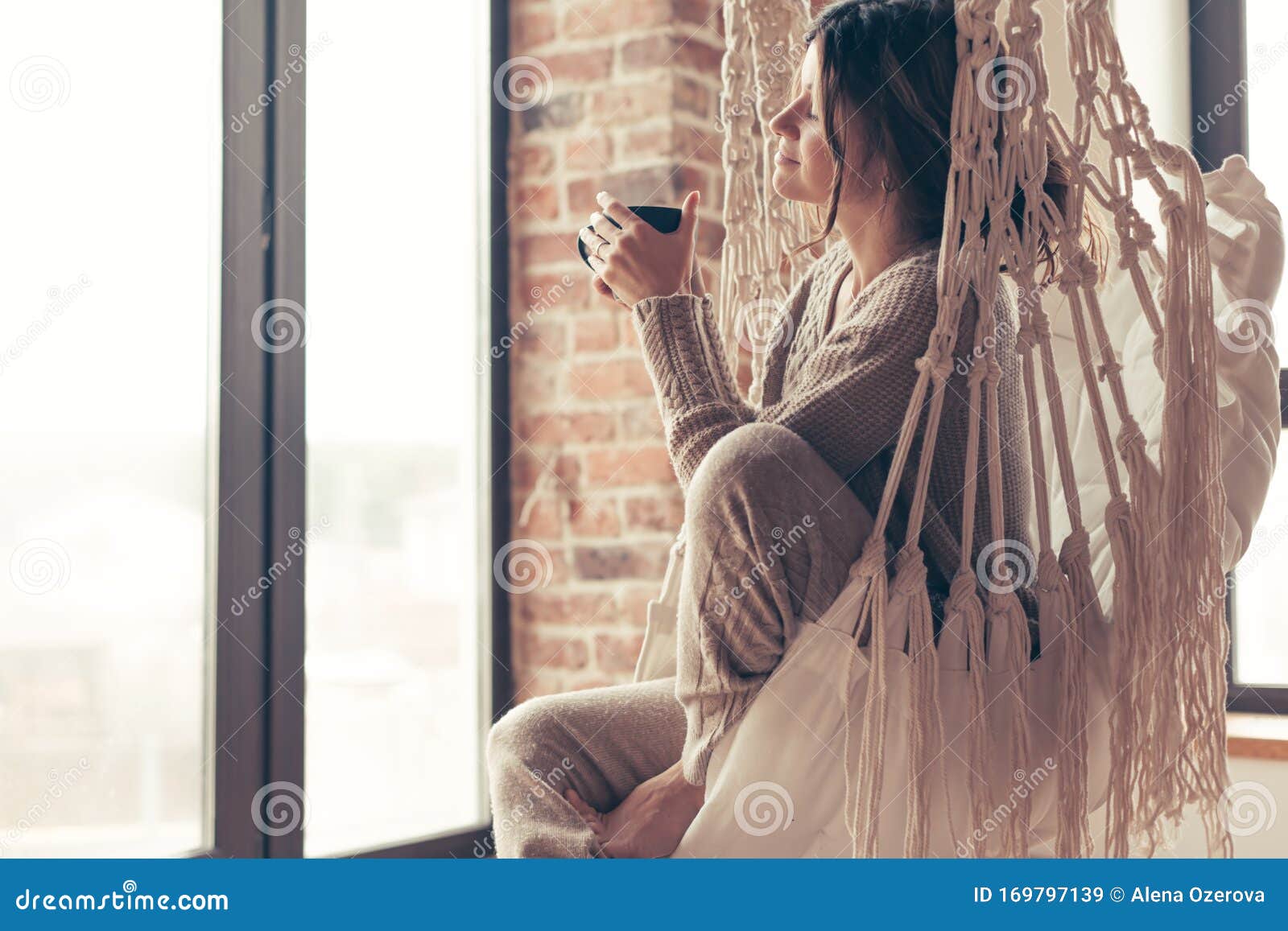 woman wearing cashmere nightwear relaxing in cabin