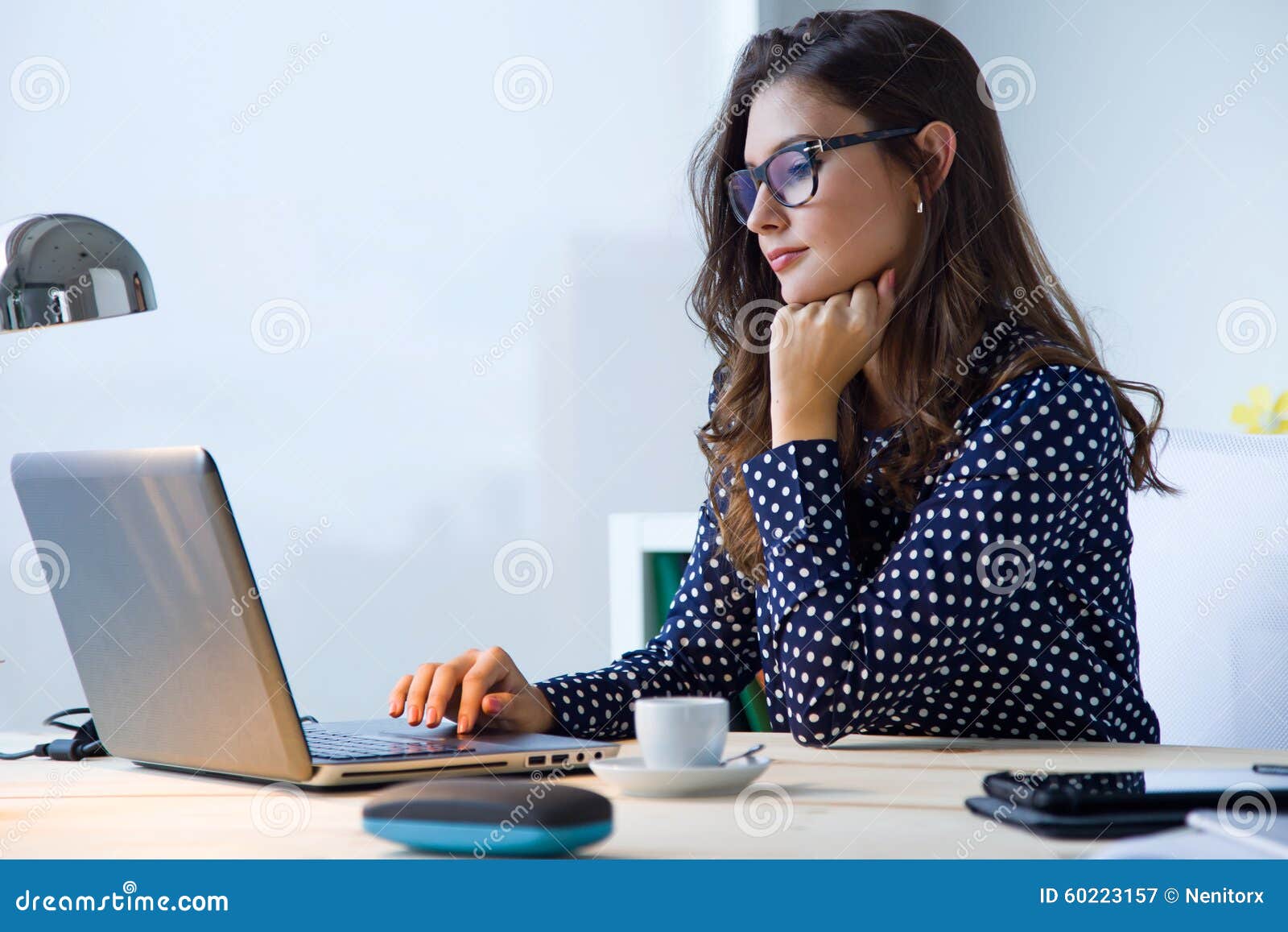 Beautiful Young Woman Working With Laptop In Her Office Stock Image