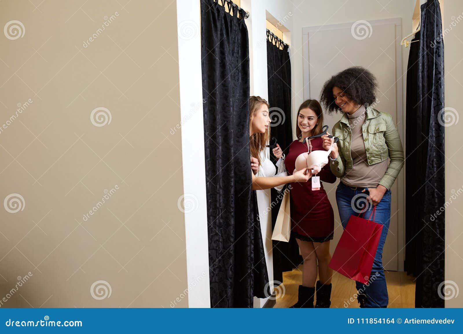 Woman Is Choosing A New Panties In The Fitting Room Concept. Stock Photo,  Picture and Royalty Free Image. Image 154087951.