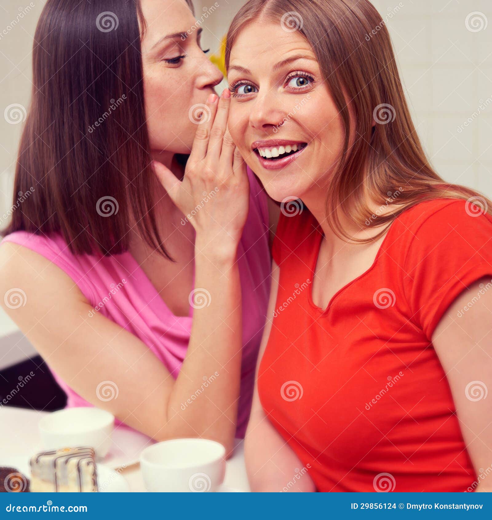 Woman Whispering Message To Her Friend Stock Photo Image