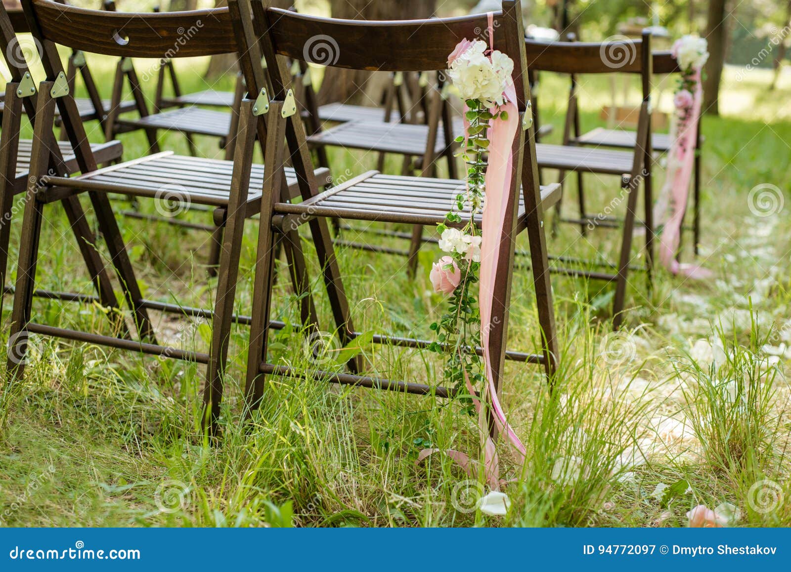 Beautifully Decorated Chairs for Wedding Reception Outdoors. Stock