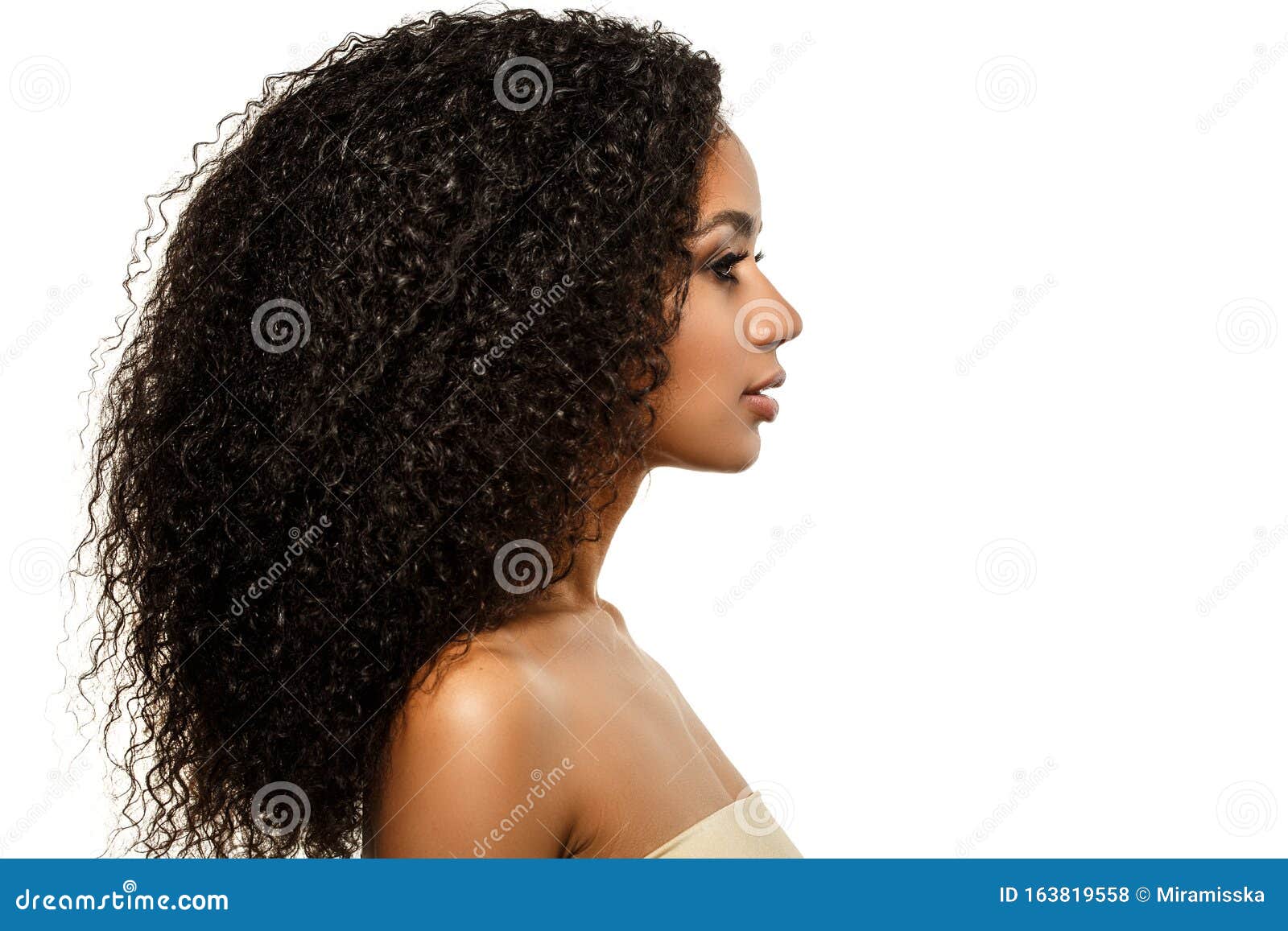 beauty black skin woman african ethnic female face. young african american model with long afro hair. lux model in profile