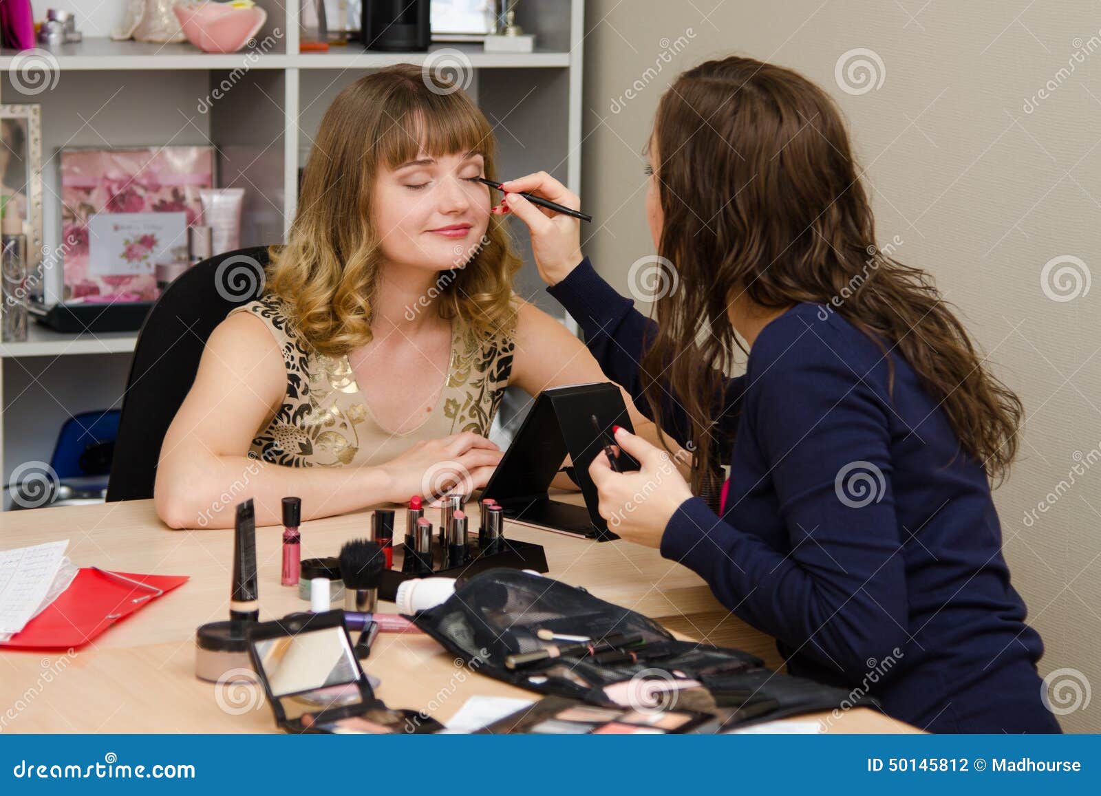 Beauty Consultant Brings Eyelashes Client Stock Photo - Image of