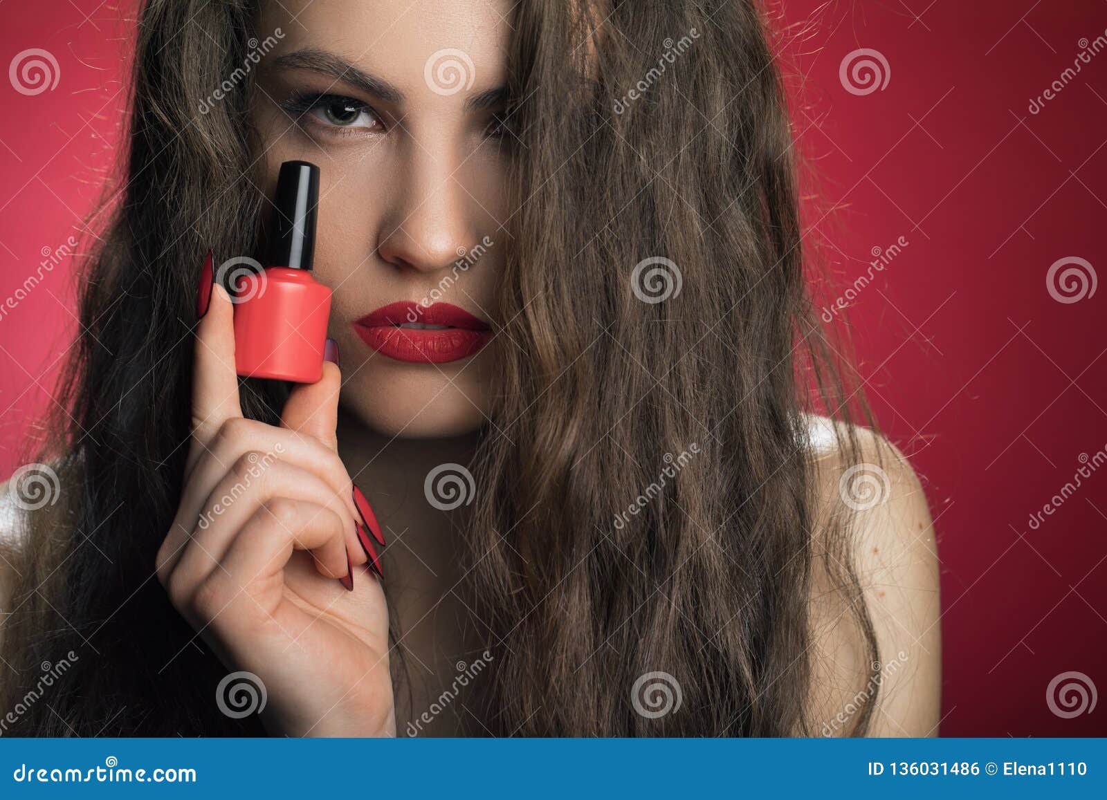 beauty fashion model girl with red nailart and make up, hair and red background