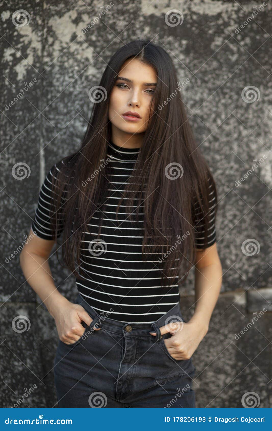 Beauty Frontal Portrait of a Girl with Green Eyes and Straight Brown Hair,  with Makeup, Supported by a Black Wall. Stock Image - Image of model, cute:  178206193