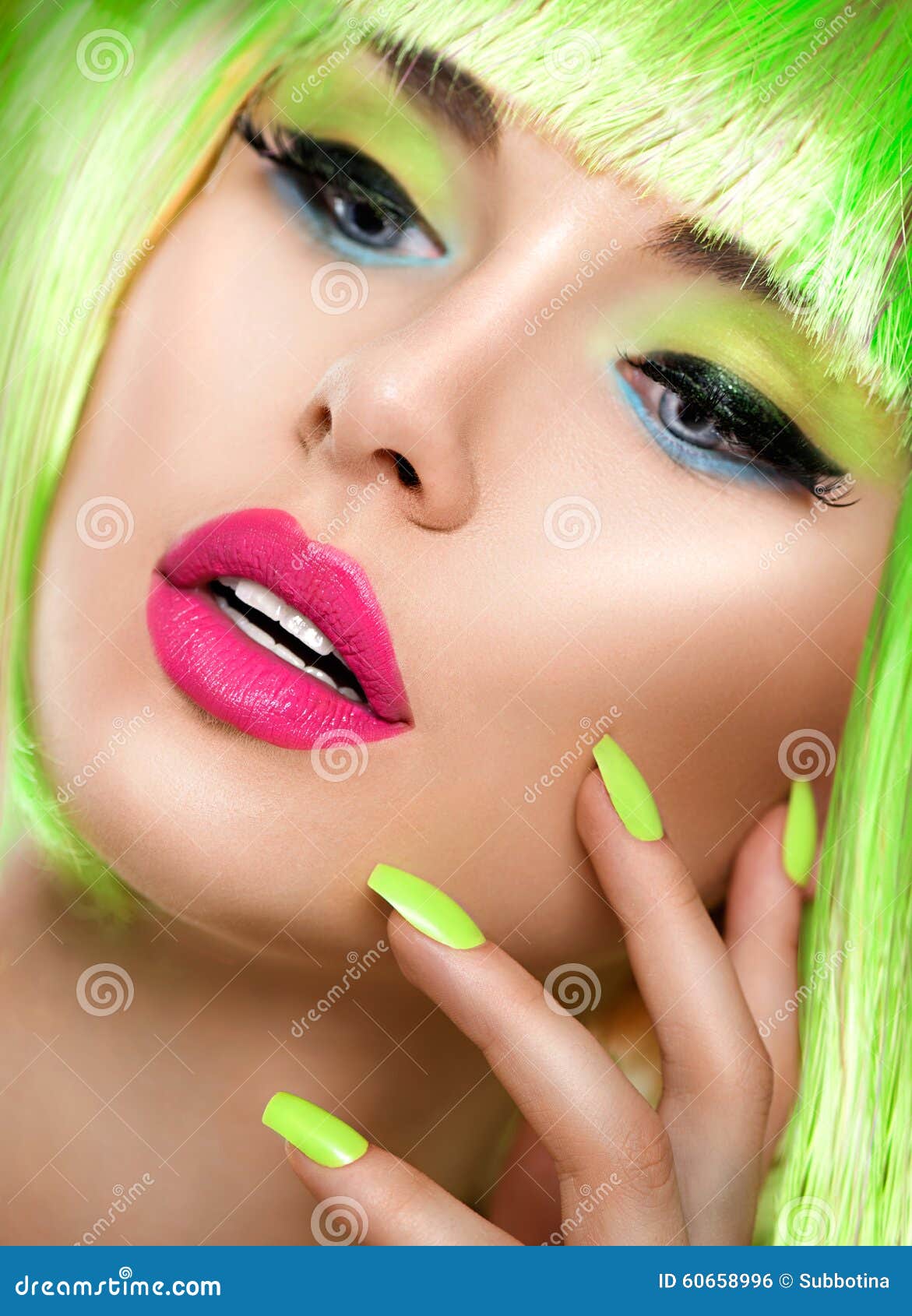 beauty girl with vivid makeup and bright green nailpolish