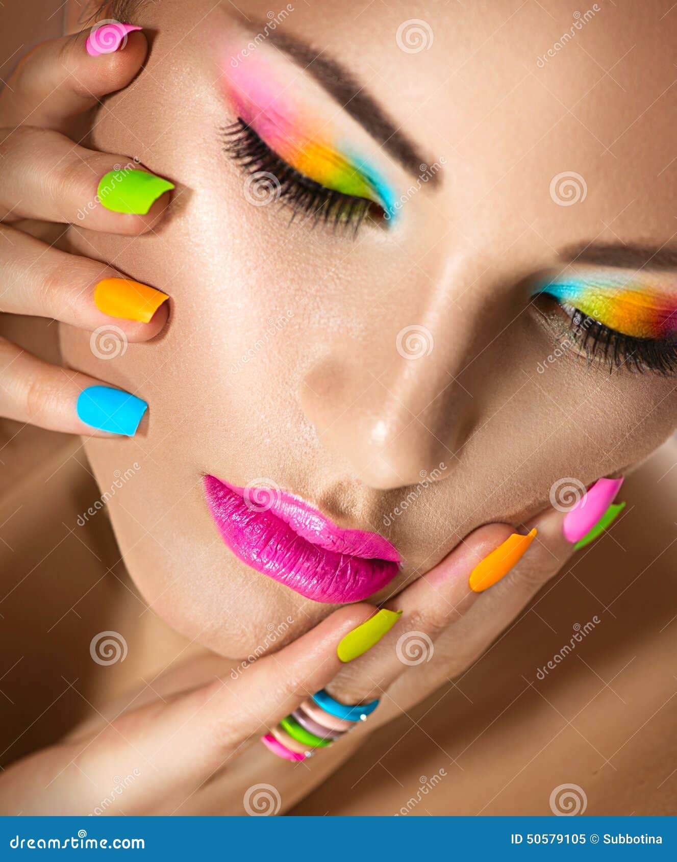 beauty girl with vivid makeup and colorful nailpolish