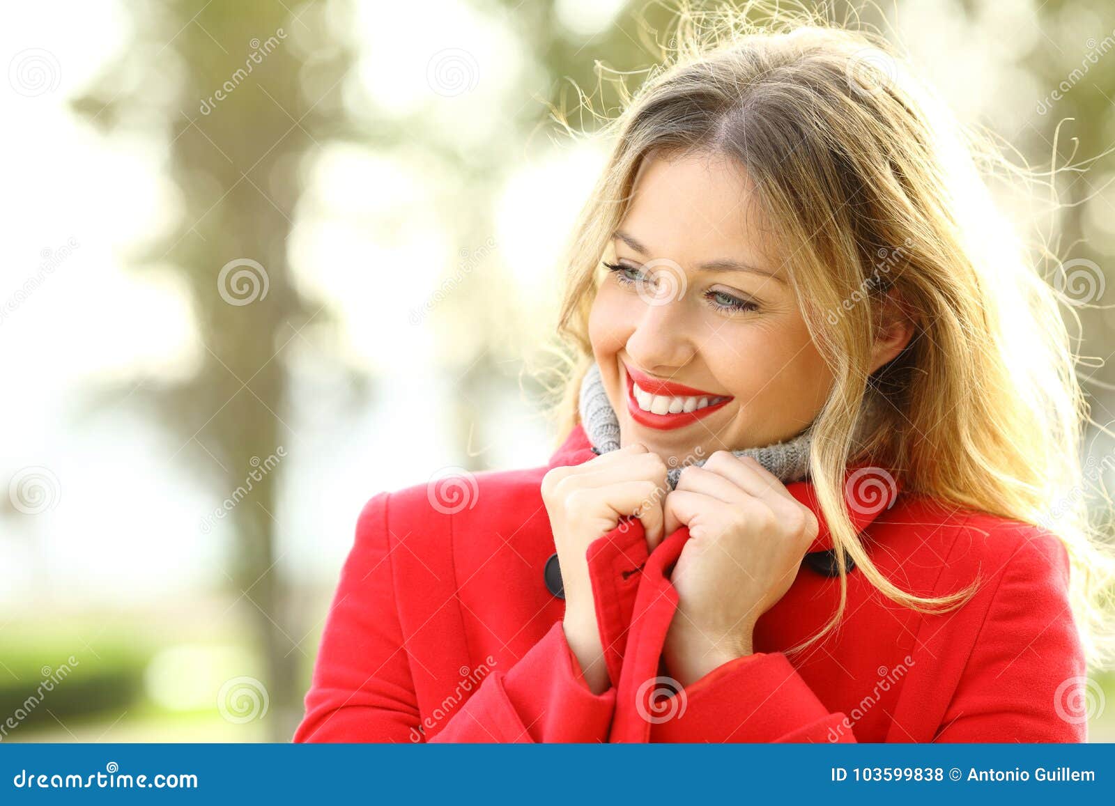 beauty girl warmly clothed wearing red jacket in winter