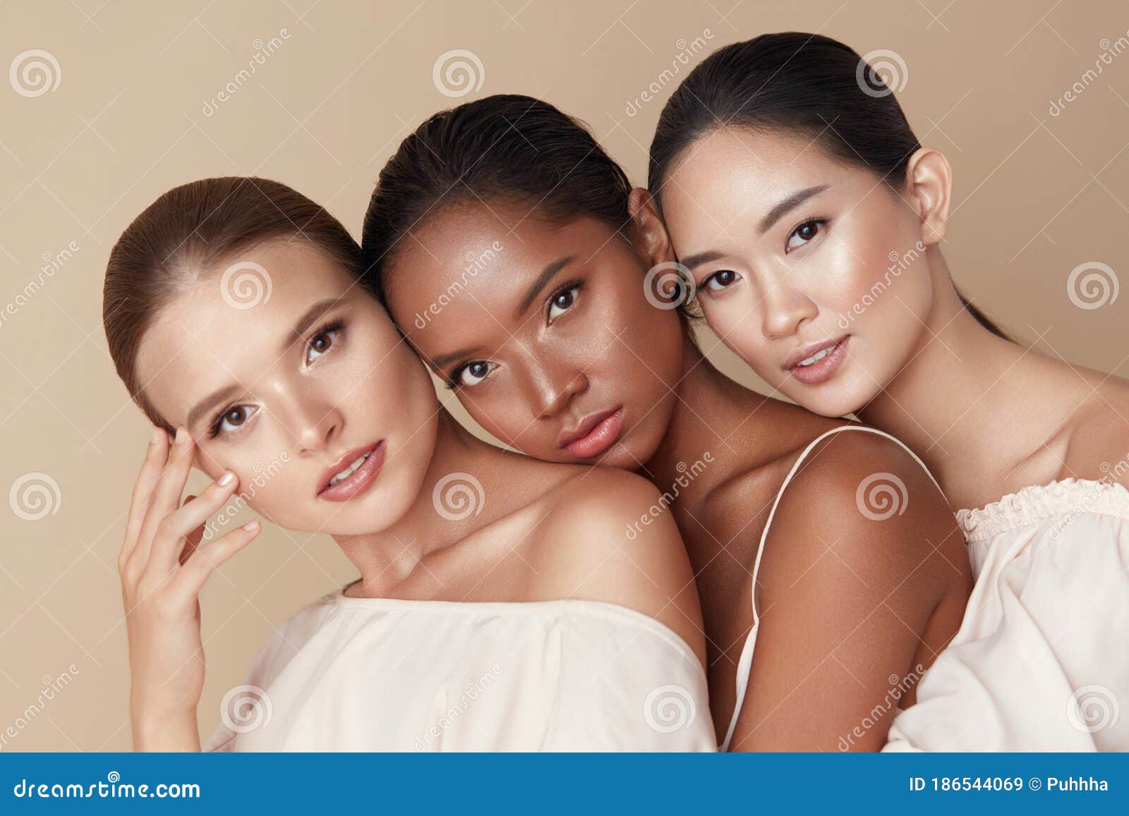 beauty. group of diversity models portrait. multi-ethnic women with different skin types posing on beige background. tender