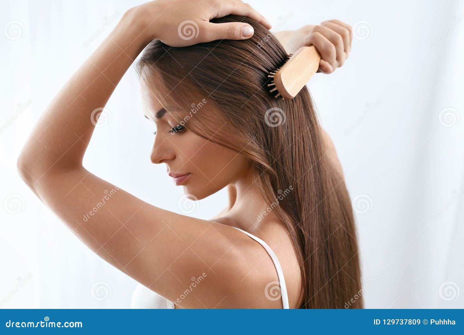 beauty hair care. beautiful woman brushing long healthy hair