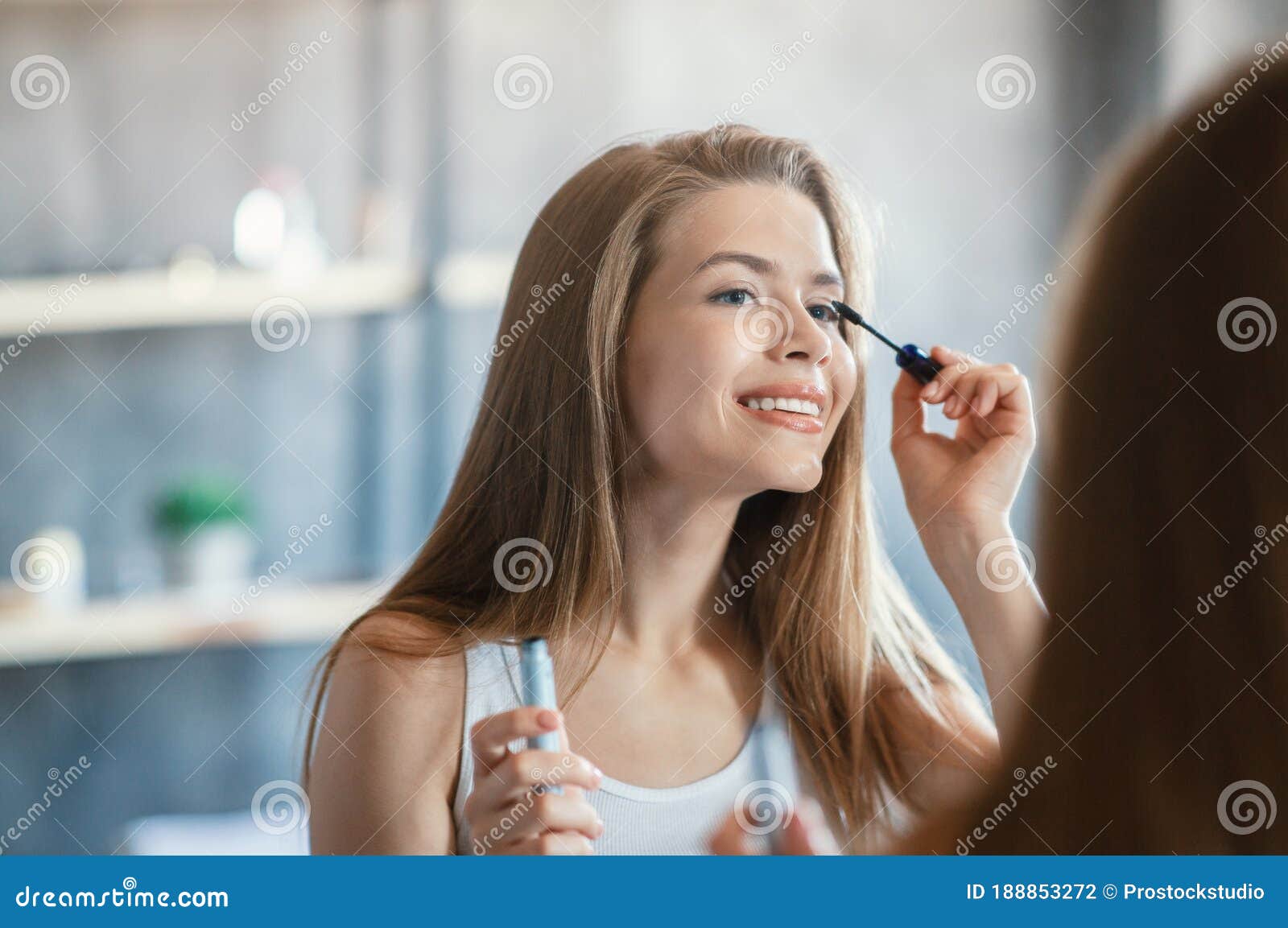 Beauty And Makeup. Sweet Lady Applying Mascara On Her ...