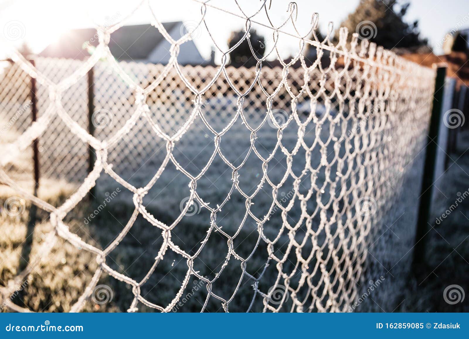 Metallic Chain Fence Link Net With Blue Defocused Background. Frosty ...
