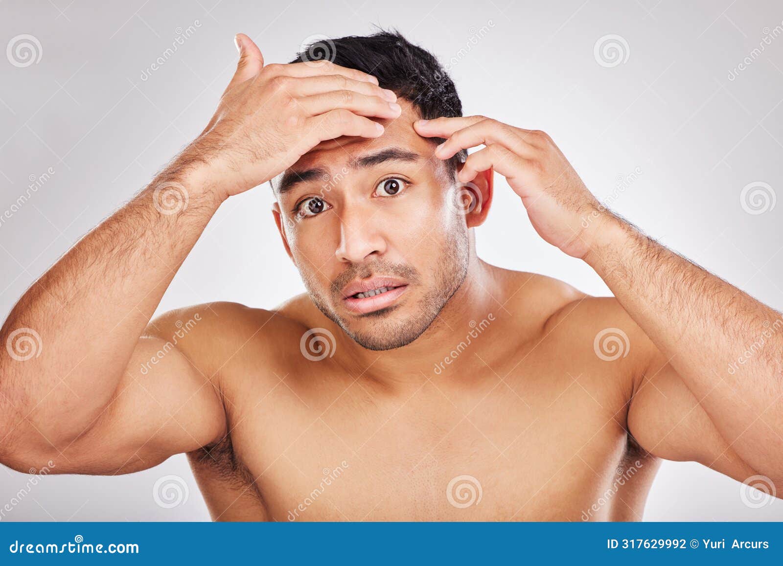 beauty, pimple and portrait of natural man in studio on white background for inspection or skincare. acne, blemish and