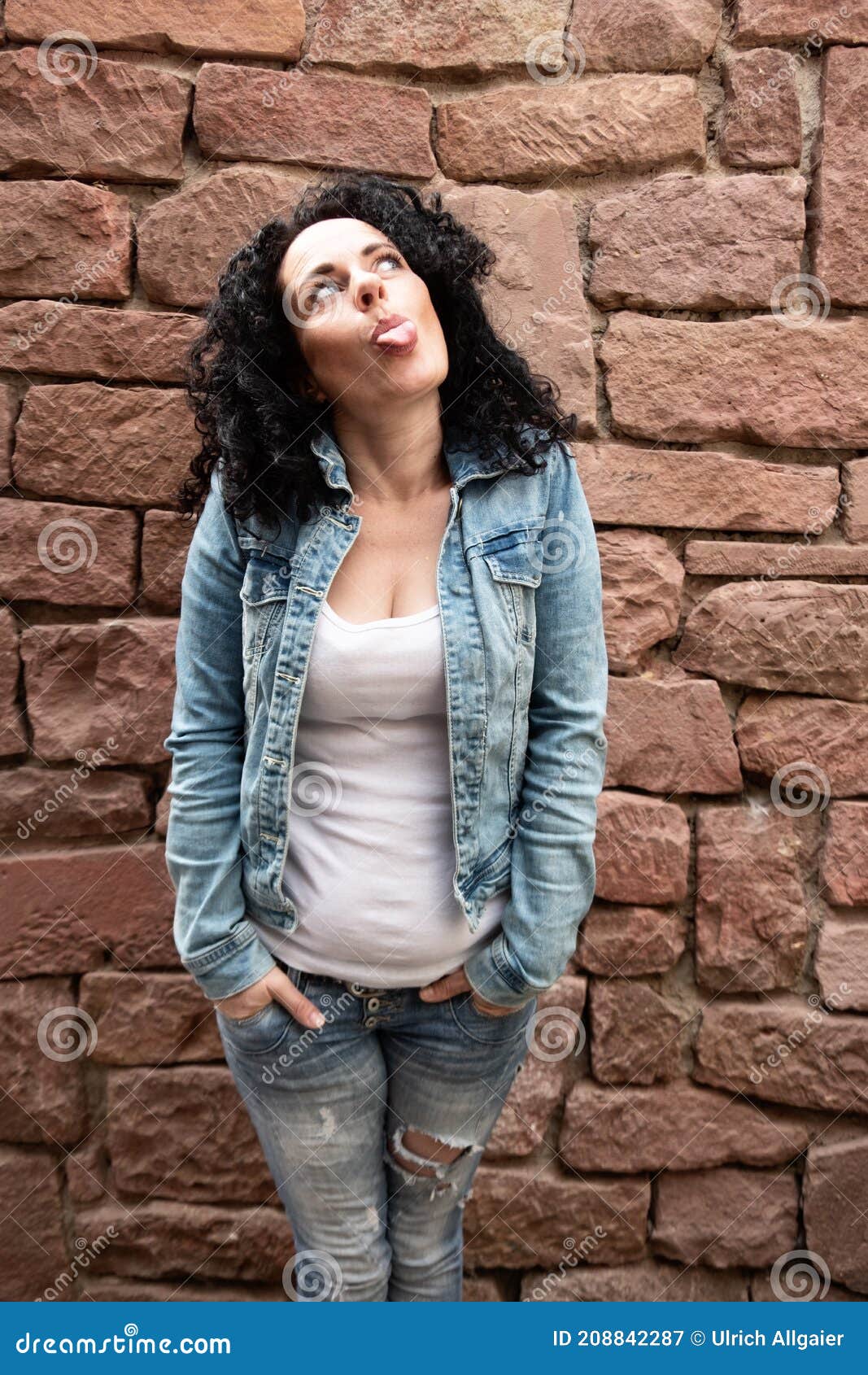 Naughty Mature Woman With Curly Dark Hair And White Shirt And Jeans 