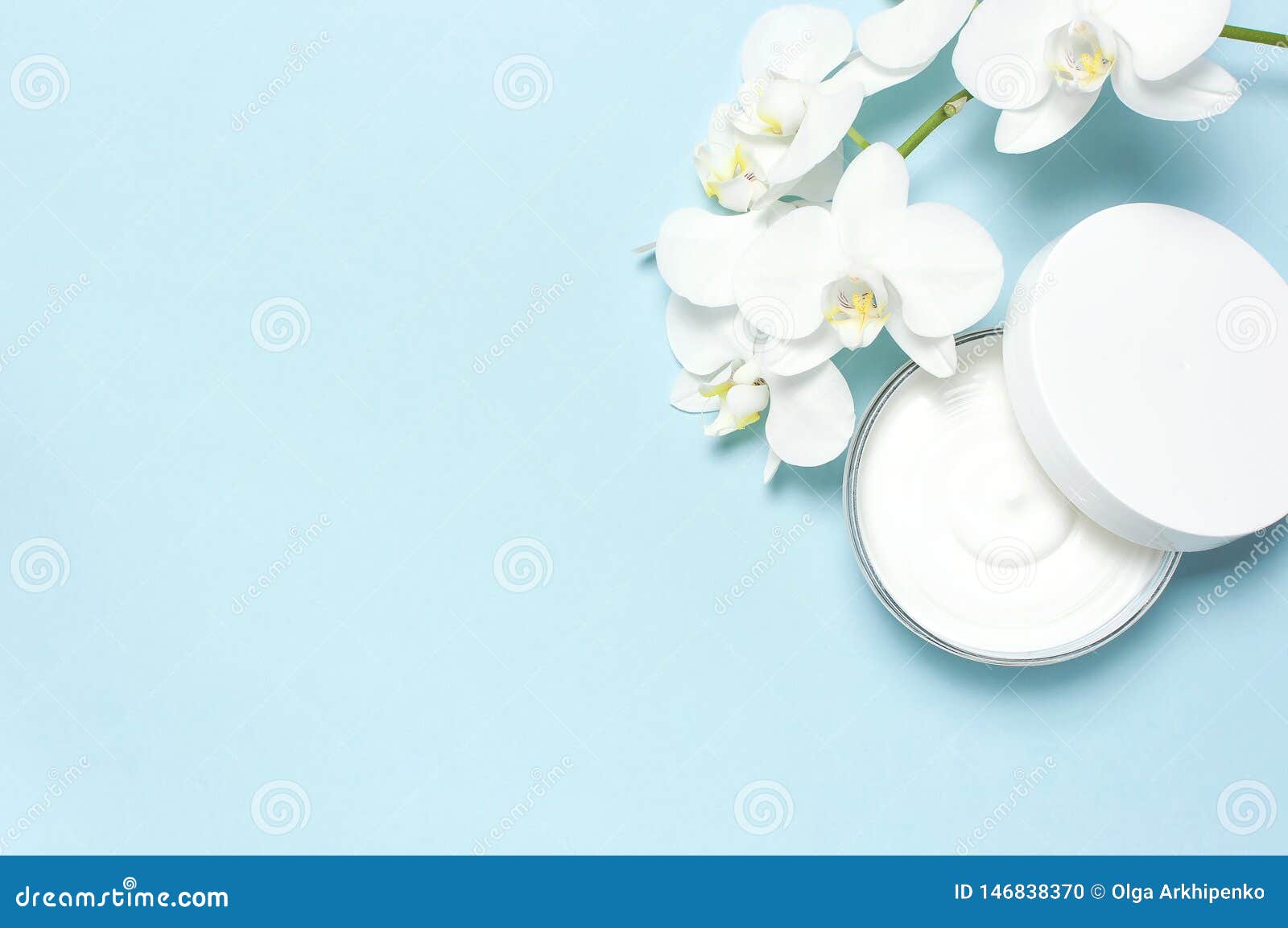 Beauty Spa Concept. Opened Plastic Container with Cream and White  Phalaenopsis Orchid Flowers on Blue Background Flat Stock Photo - Image of  moisturizer, bodycare: 146838370