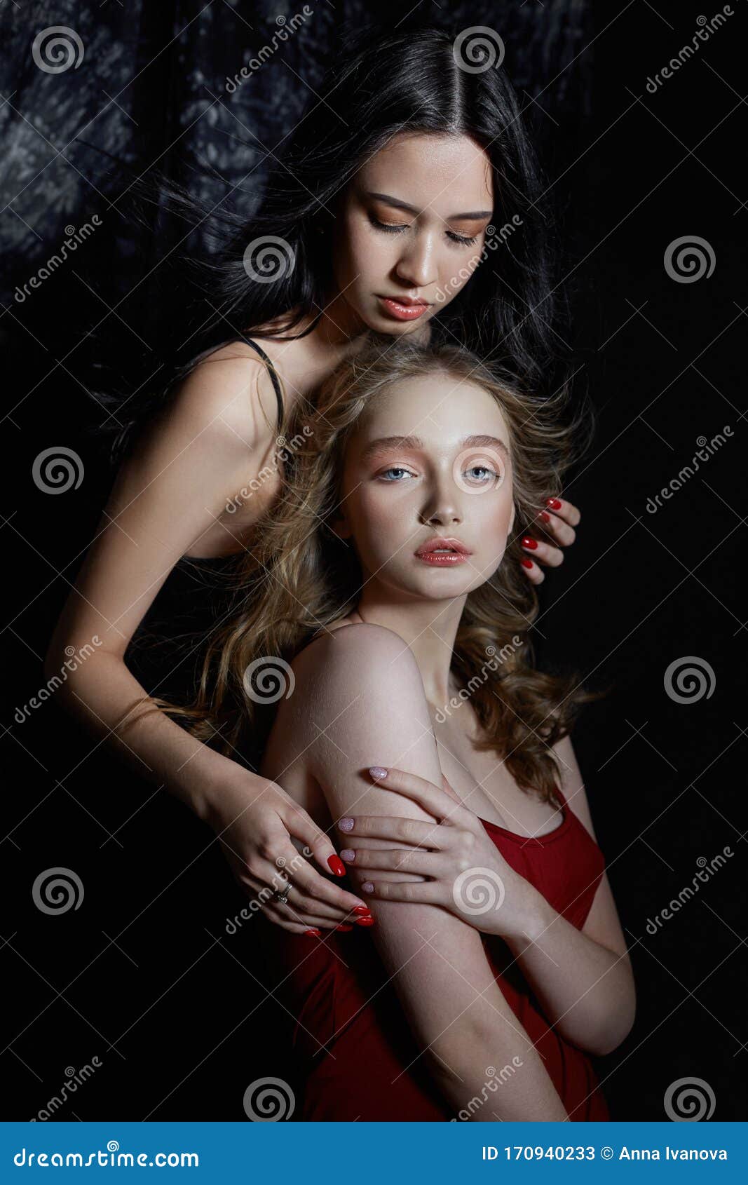 Beauty Spring Portrait Of Two Girls On A Dark Background Women Hug And