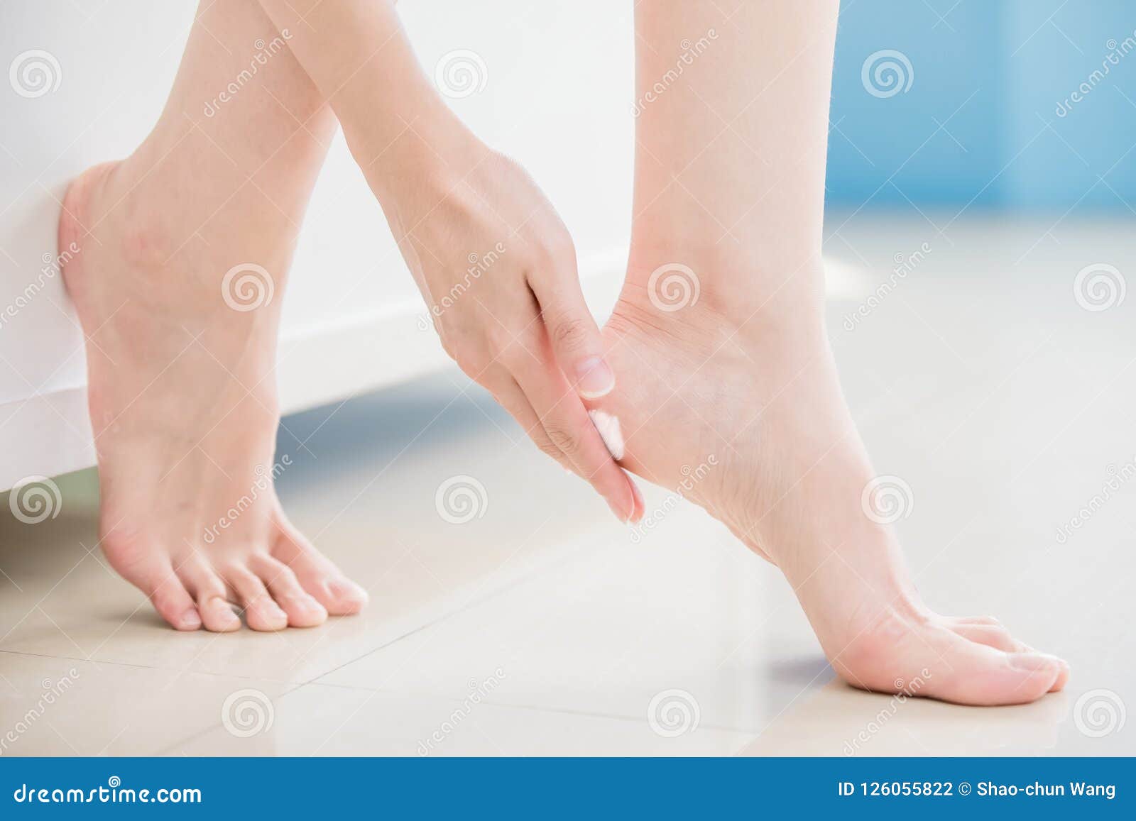 woman apply cream with foot