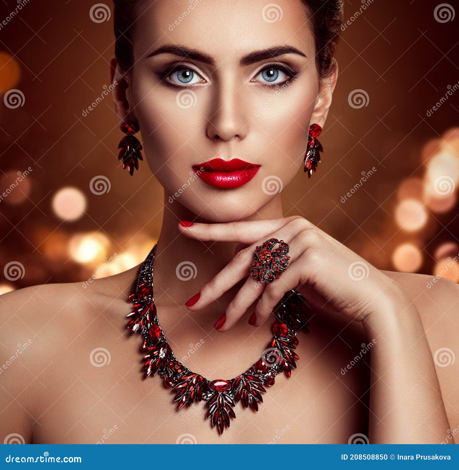 beauty woman face makeup and jewelry, fashion model portrait with jewellery over shining lights background