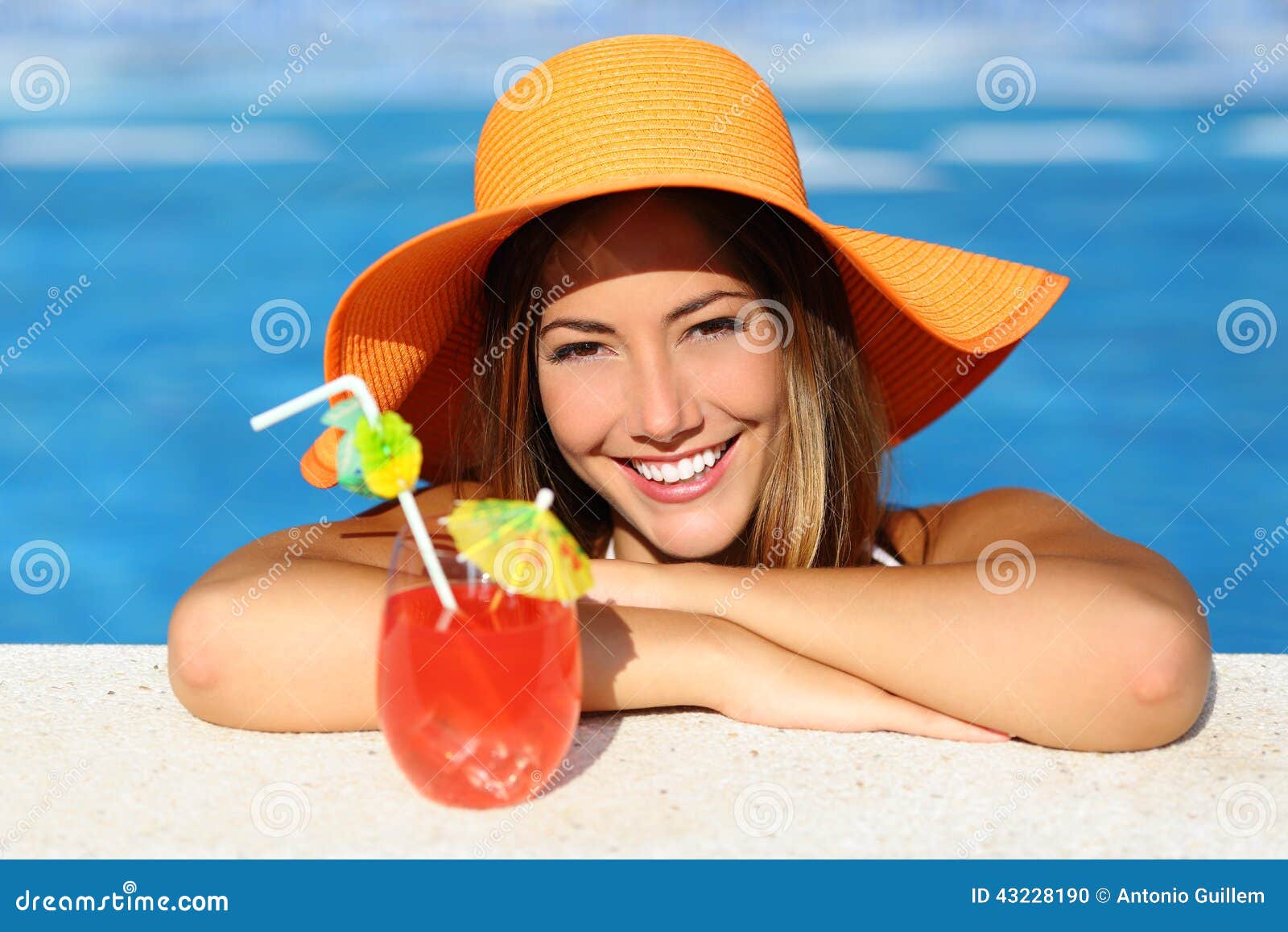 beauty woman with perfect smile enjoying in a swimming pool on vacations