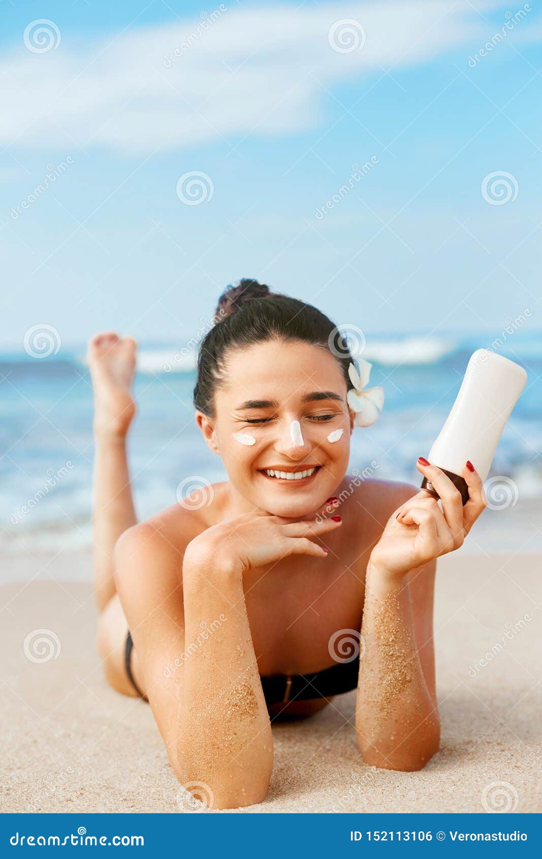 Beauty Woman Skin Care Sunscreen Holding Bottles in Her Hands