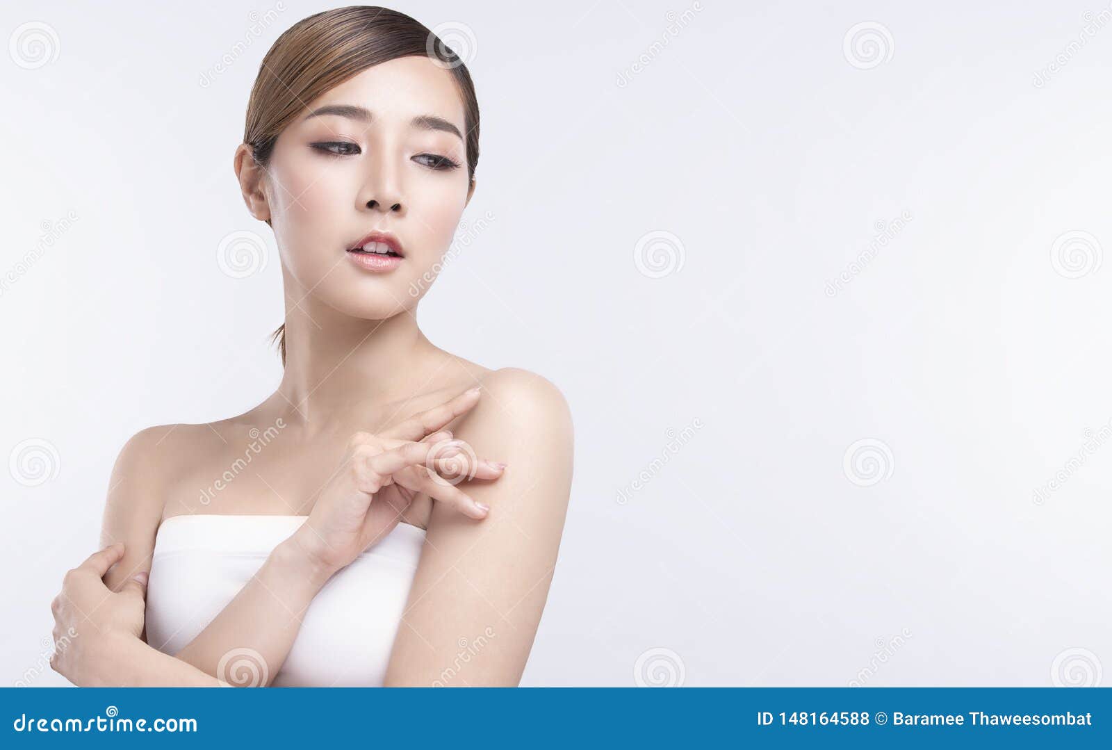 beauty young asian woman with perfect facial skin. gestures for advertisement treatment spa and cosmetology