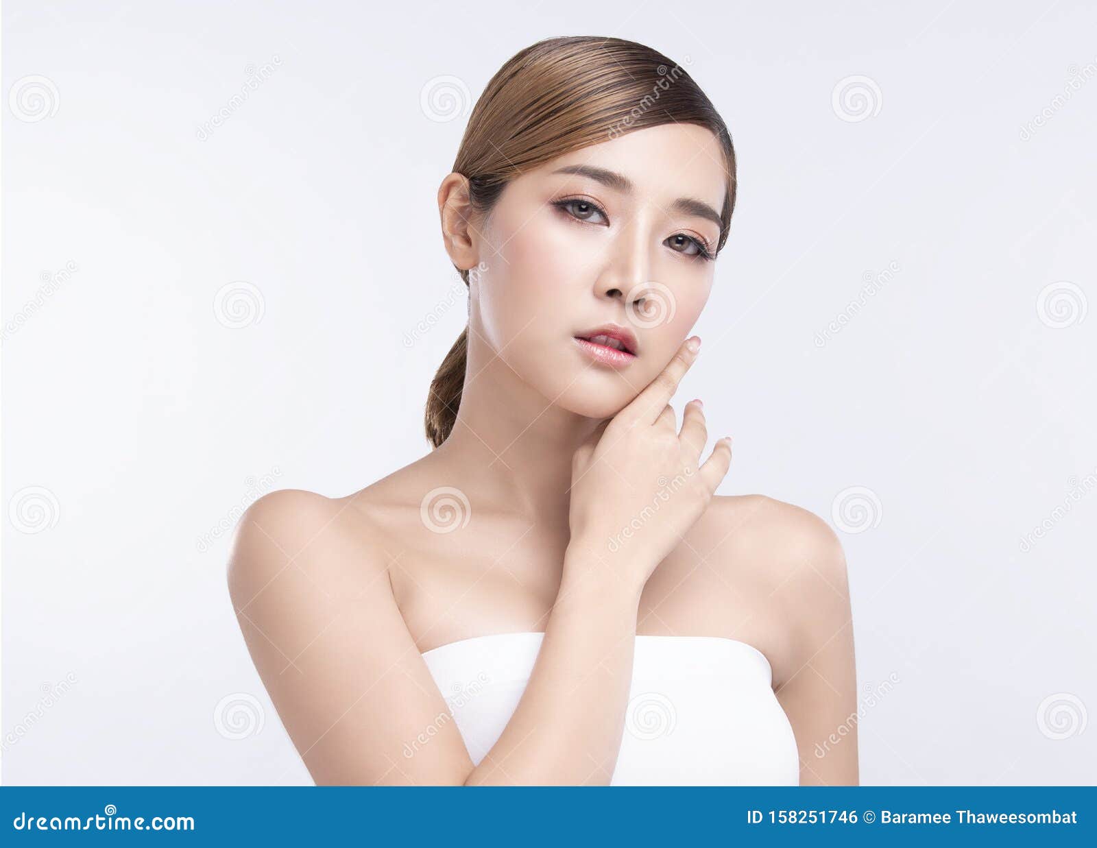 beauty young asian woman with perfect facial skin. gestures for advertisement treatment spa and cosmetology