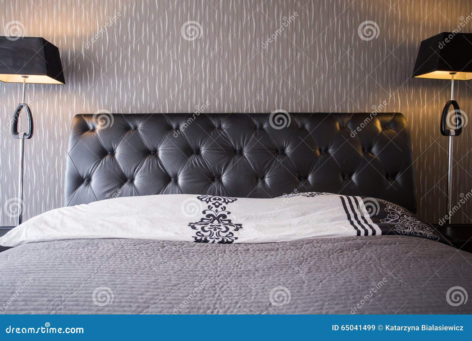 Bed with leather headrest stock image. Image of bedroom 65041499
