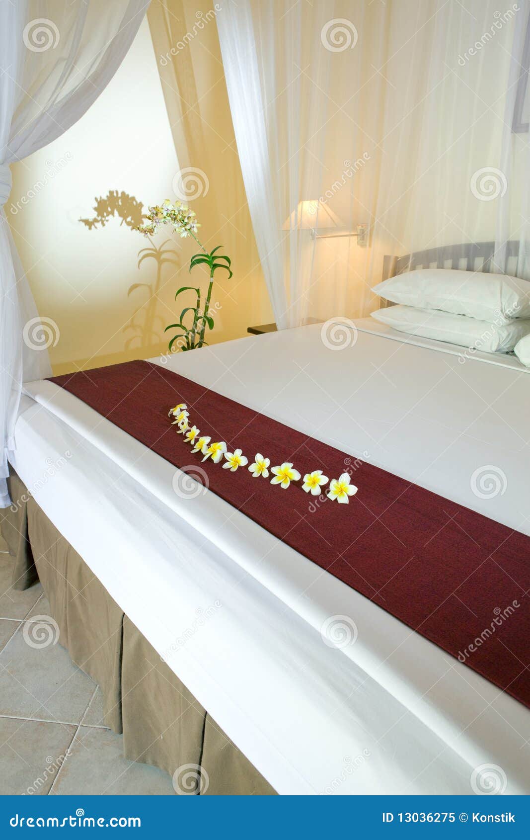 Bed under bed curtains stock image. Image of blanket 13036275