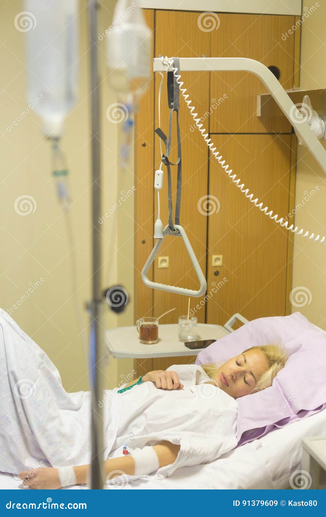 bedridden female patient recovering after surgery in hospital care.