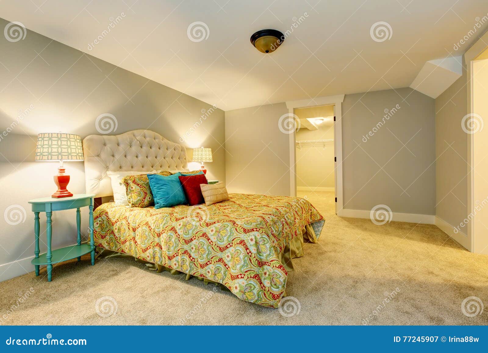 Bedroom Interior with Carpet Floor and Nice Bedding. Stock Image