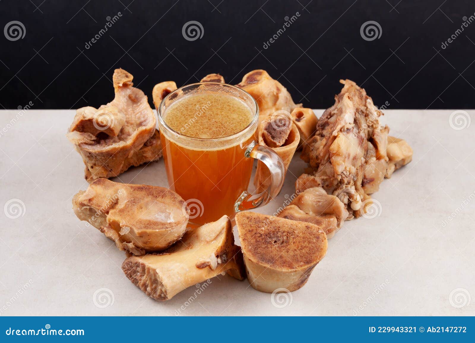 Beef Bone Broth in Mug on Dark Background. Selective Focus, Top View